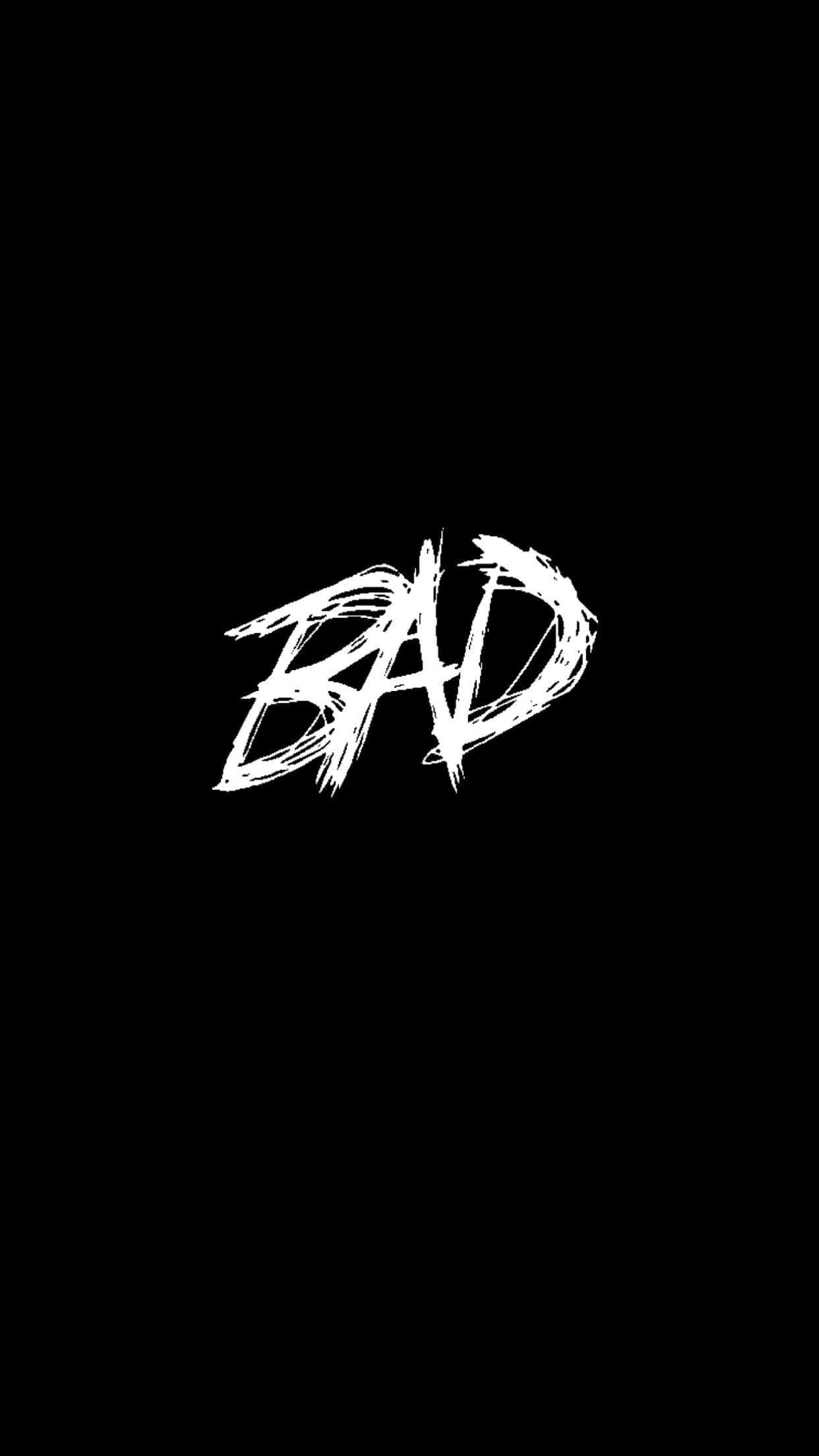 bad 桌布 壁紙 — 單詞 BAD 以粗體白色塗鴉風格字體居中顯示在純黑色背景上。