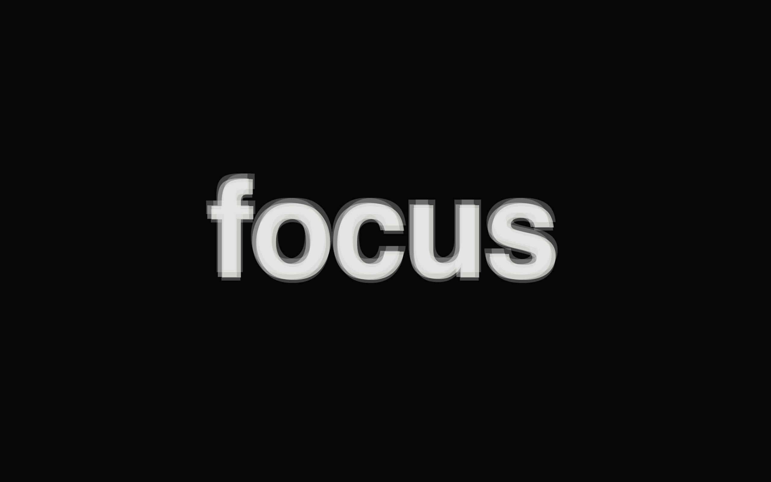 Focus 桌布 壁紙 — 單詞 focus 以粗體白色 3D 字母居中顯示在純黑色背景上。