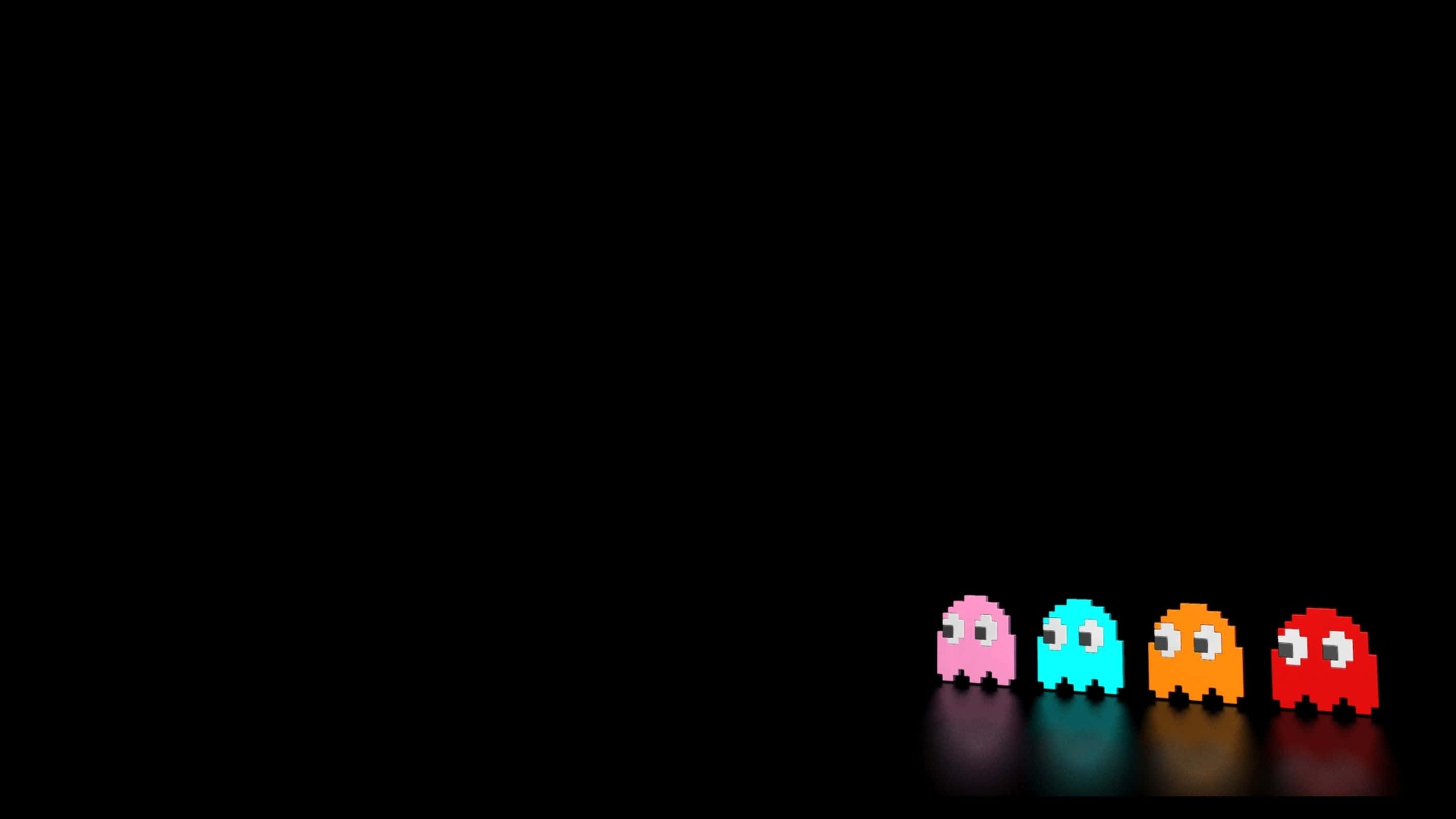 「Let's Play!」 壁紙 — 四個來自 Pac-Man 的彩色像素鬼魂排成一排，背景為黑色，帶有微妙的反射。