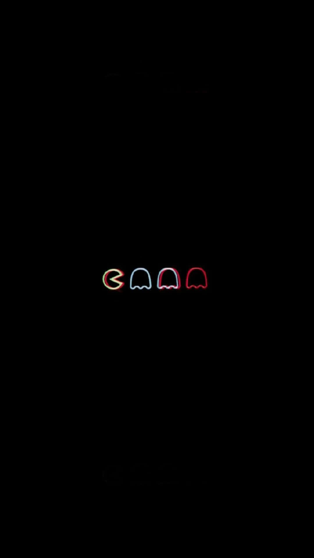 Aesthetic Grunge Phone 桌布 壁紙 — 四個發光的 Pac-Man 鬼魂，以紅色、藍色和橙色霓虹燈呈現，背景為漆黑一片。