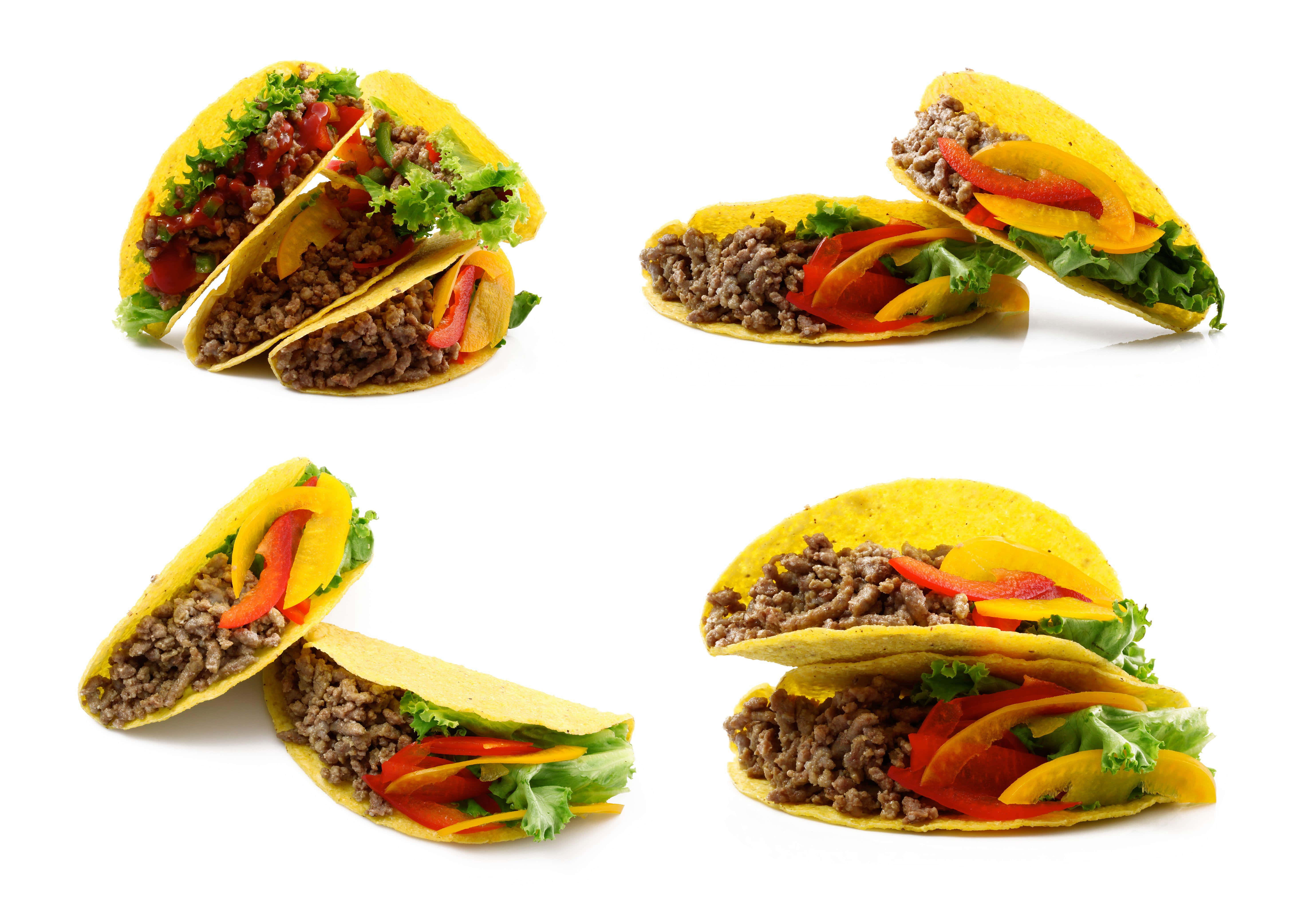Taco 桌布 壁紙 — 四個開胃的墨西哥卷餅，內餡有調味肉、彩色甜椒和新鮮生菜，排列在乾淨的白色背景上。