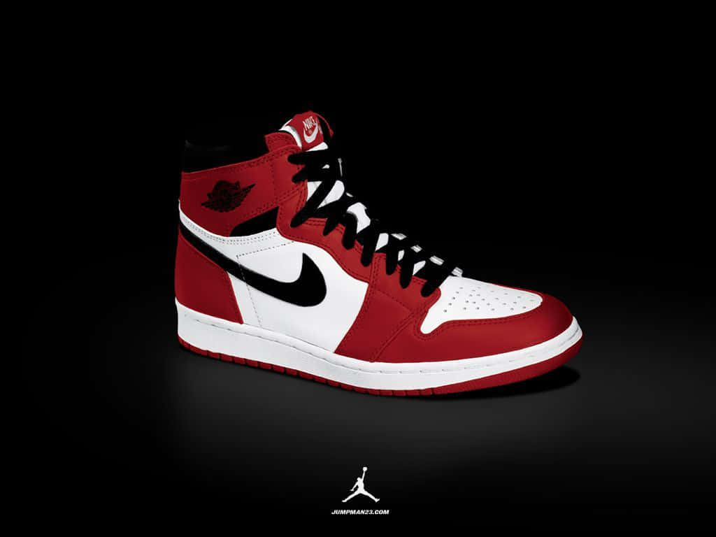 黑色背景上的紅、白、黑色 Air Jordan 運動鞋