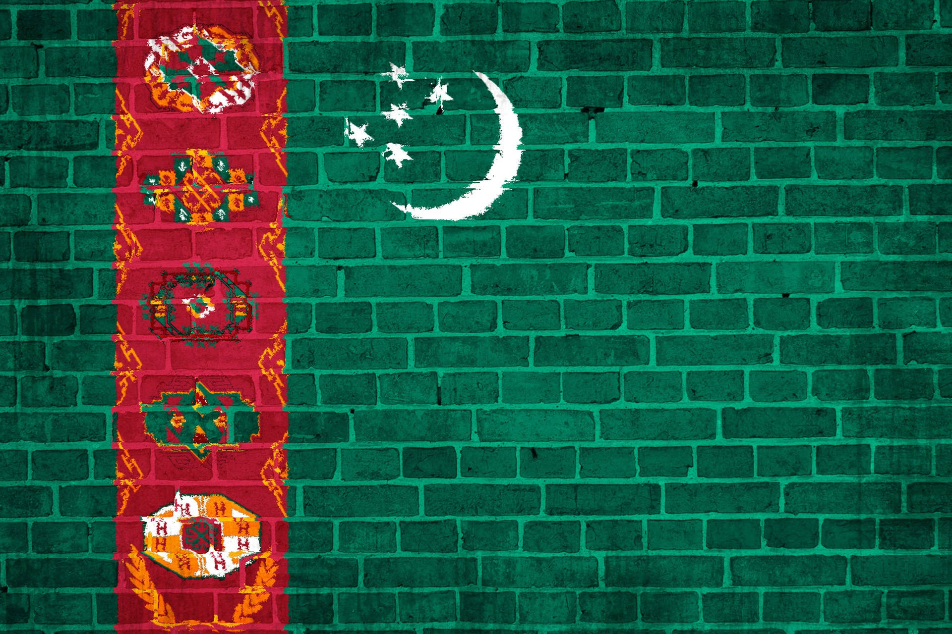 土庫曼斯坦國旗塗於牆上 壁紙 — 塔吉克斯坦國旗繪在風化的綠色磚牆上，帶有複雜的紅色垂直裝飾。