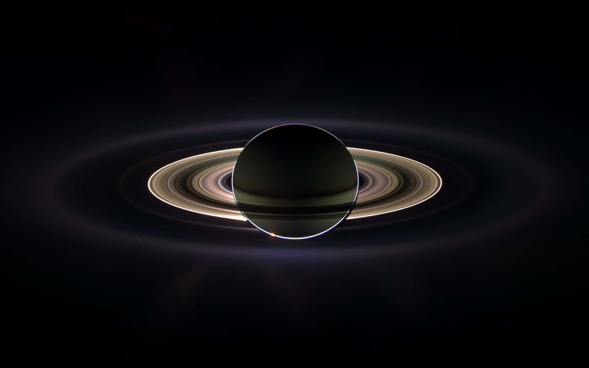  壁紙 — 土星壯麗的景象，其標誌性光環在深邃的太空黑暗中柔和發光。