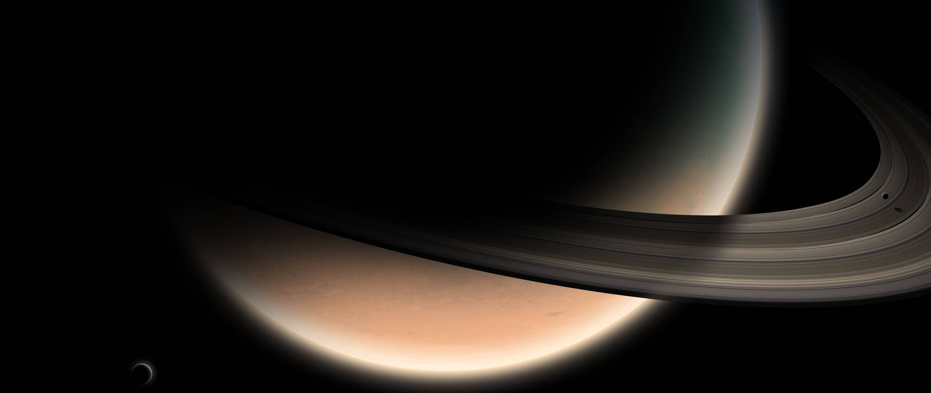 土星及其在太空中被照亮的光環 — 土星 壁紙