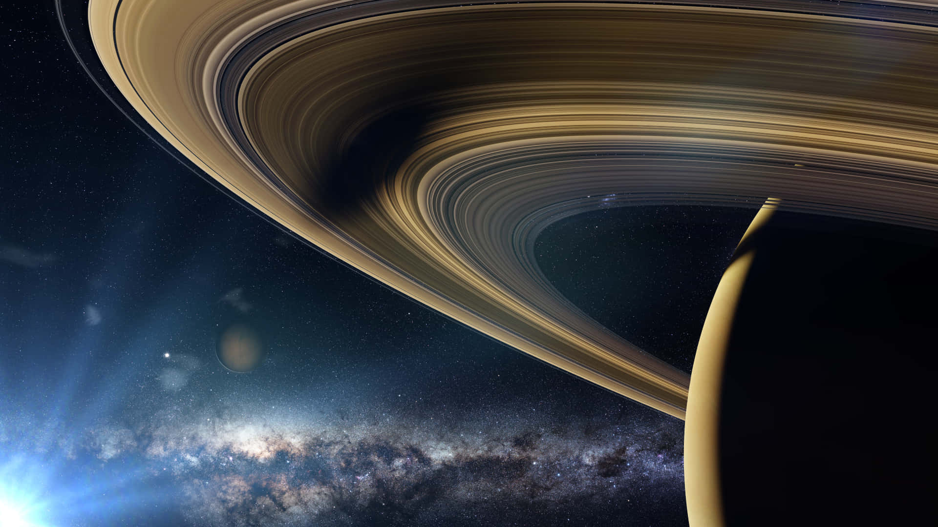土星 桌布 壁紙 — 土星複雜的金色環在充滿活力的星場和發光的星雲上空拱起的雄偉景觀。