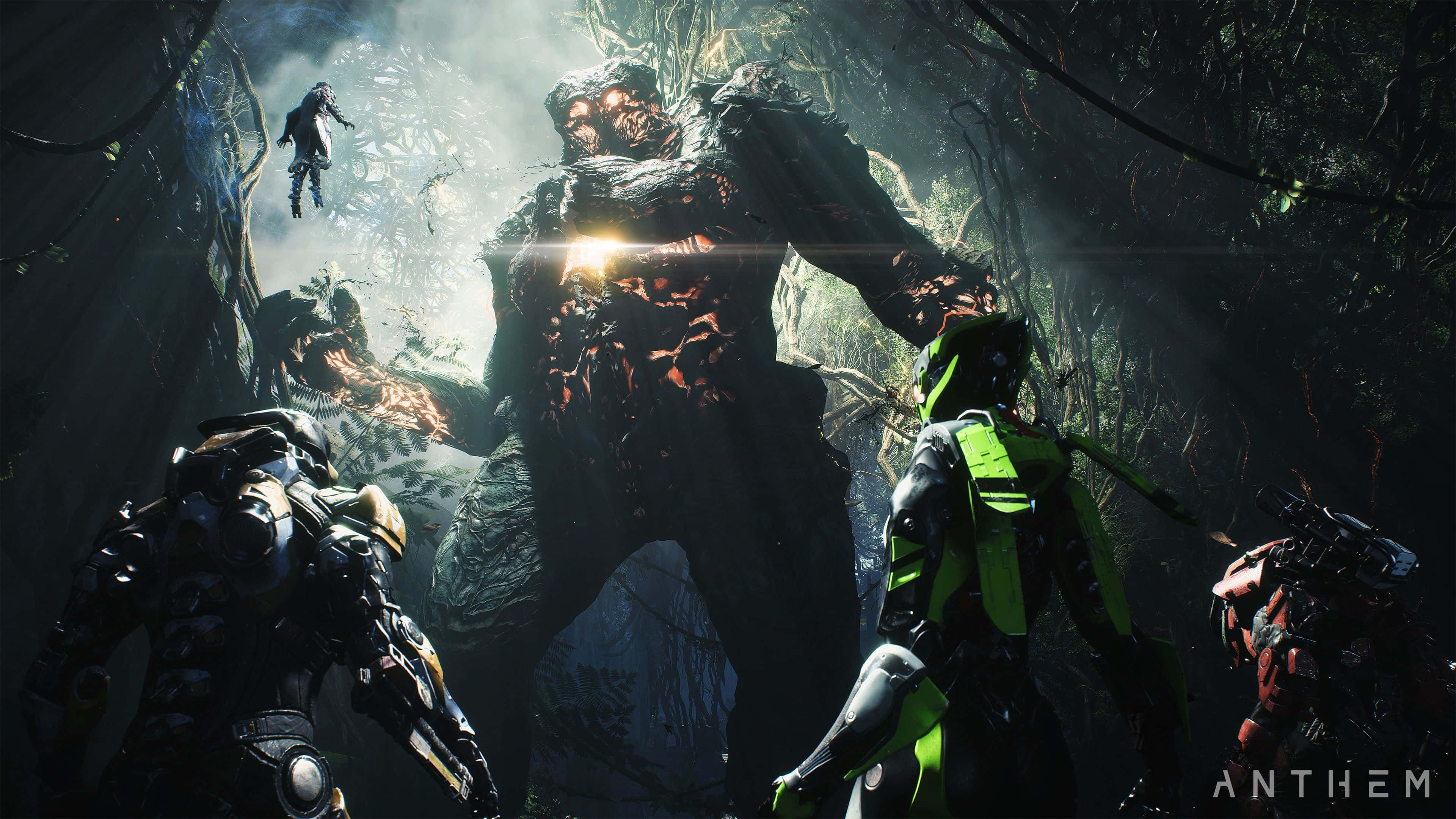 在《Anthem》中穿越奇幻世界 壁紙 — 巨大怪物籠罩著黑暗森林中的裝甲冒險者，陽光穿透樹冠。