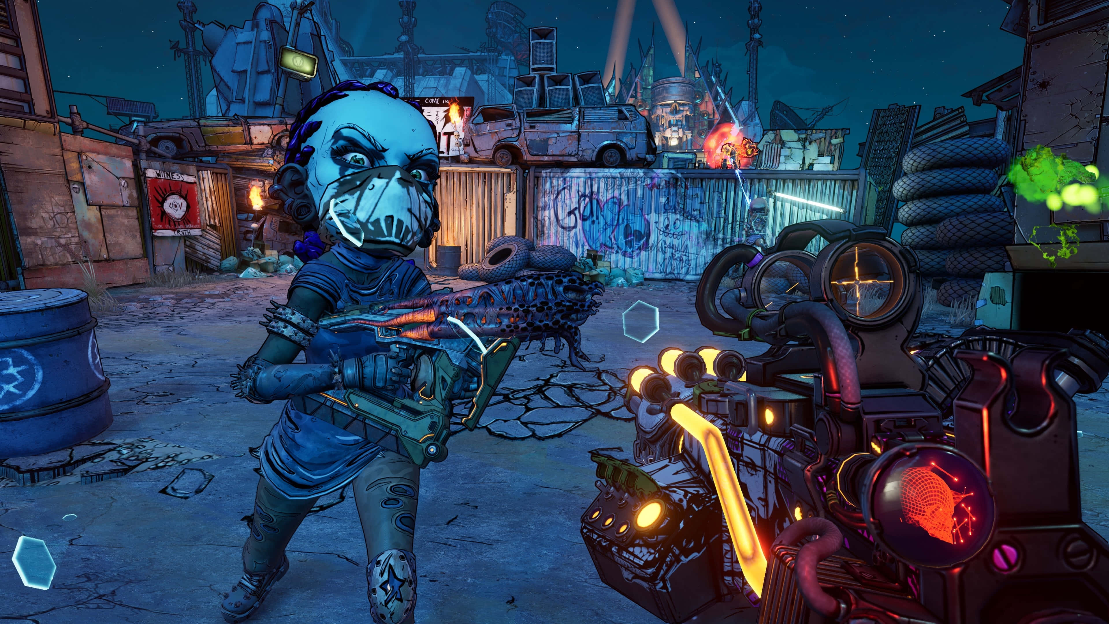 在《Borderlands 3》的荒蕪世界中展開激烈射擊戰鬥 壁紙 — 一個戴面具的角色在霓虹燈照亮嘅垃圾場向住一把有橙色燈光嘅未來槍械發射發光武器。