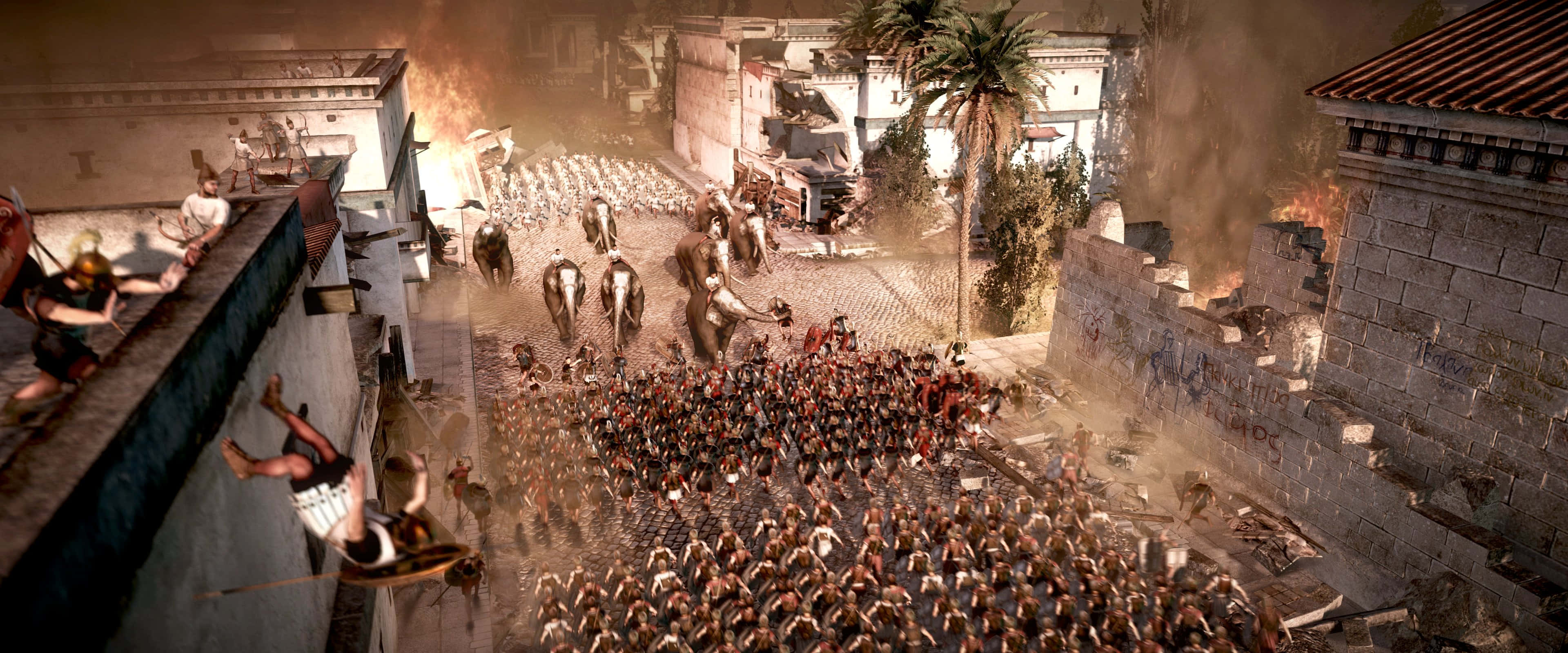 在《Total War Rome 2》中體驗古羅馬的真正力量 壁紙 — 一個混亂的古代戰場，士兵們在燃燒的城市街道上戰鬥，大象衝過人群。