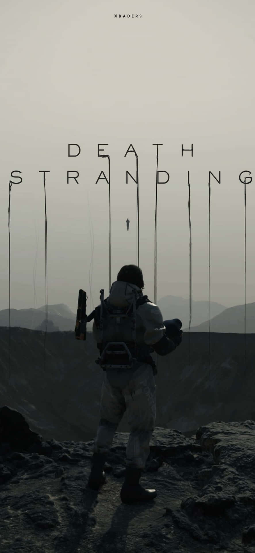 一個孤獨的身影穿著科幻套裝站在懸崖上，俯瞰著山脈，上方有「DEATH STRANDING」文字。