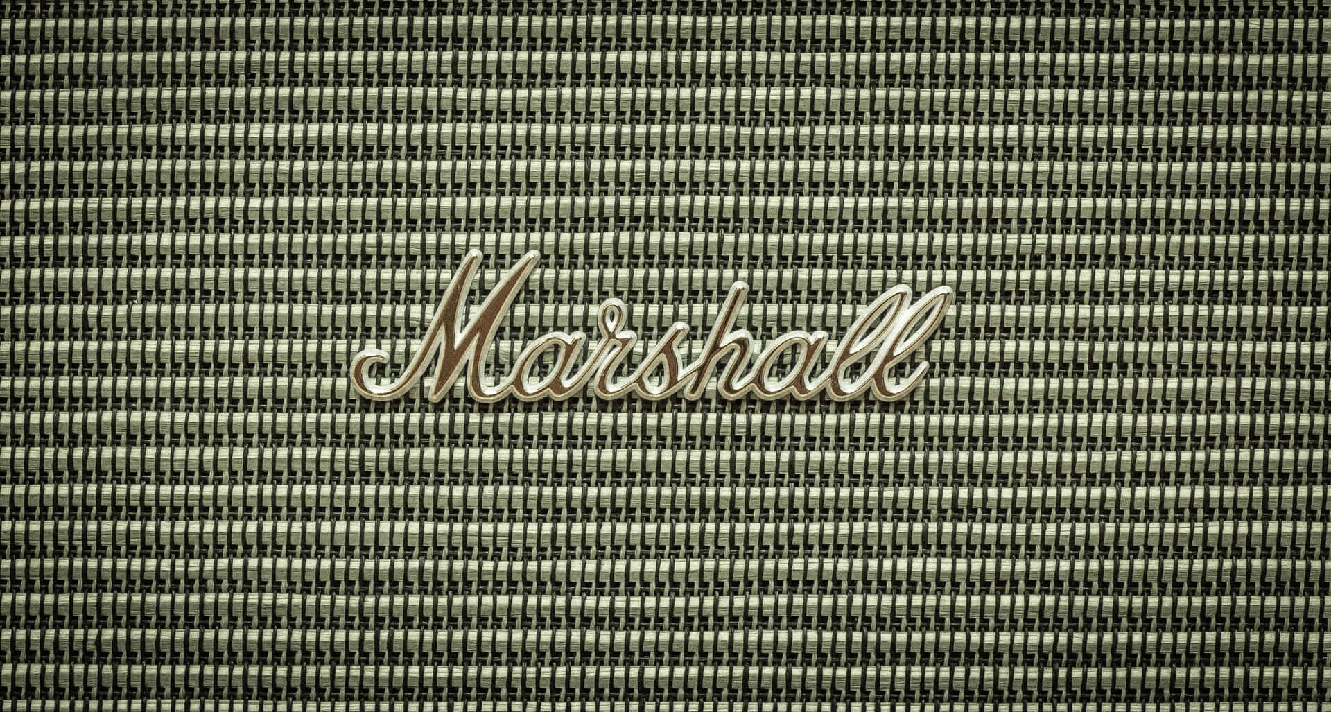 帶有金屬標誌和紋理織物背景的Marshall擴音器格柵。