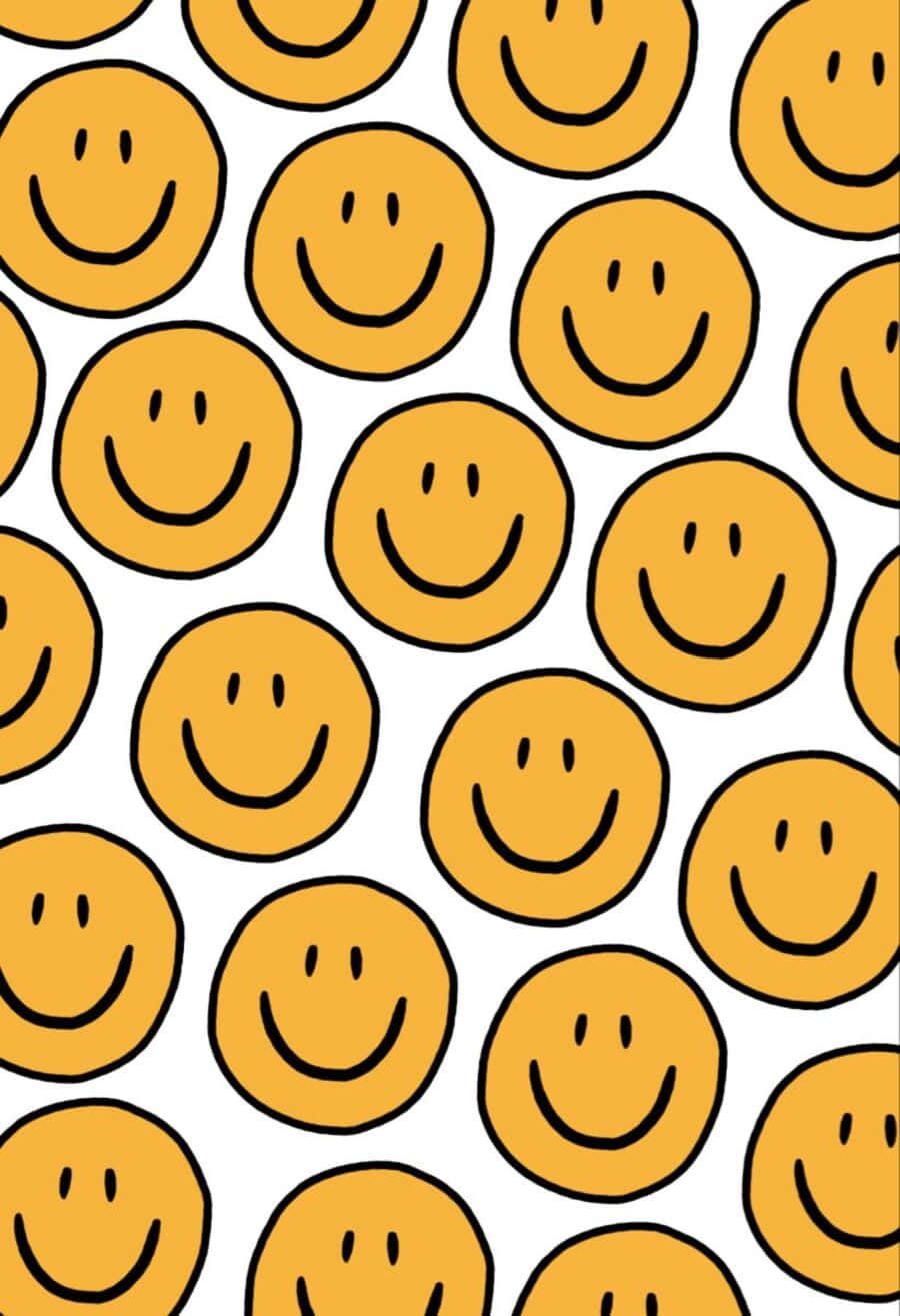 Aesthetic Smiley Face 桌布 壁紙 — 在乾淨的白色背景上，重複的圖案呈現出帶有黑色輪廓的歡樂黃色笑臉。