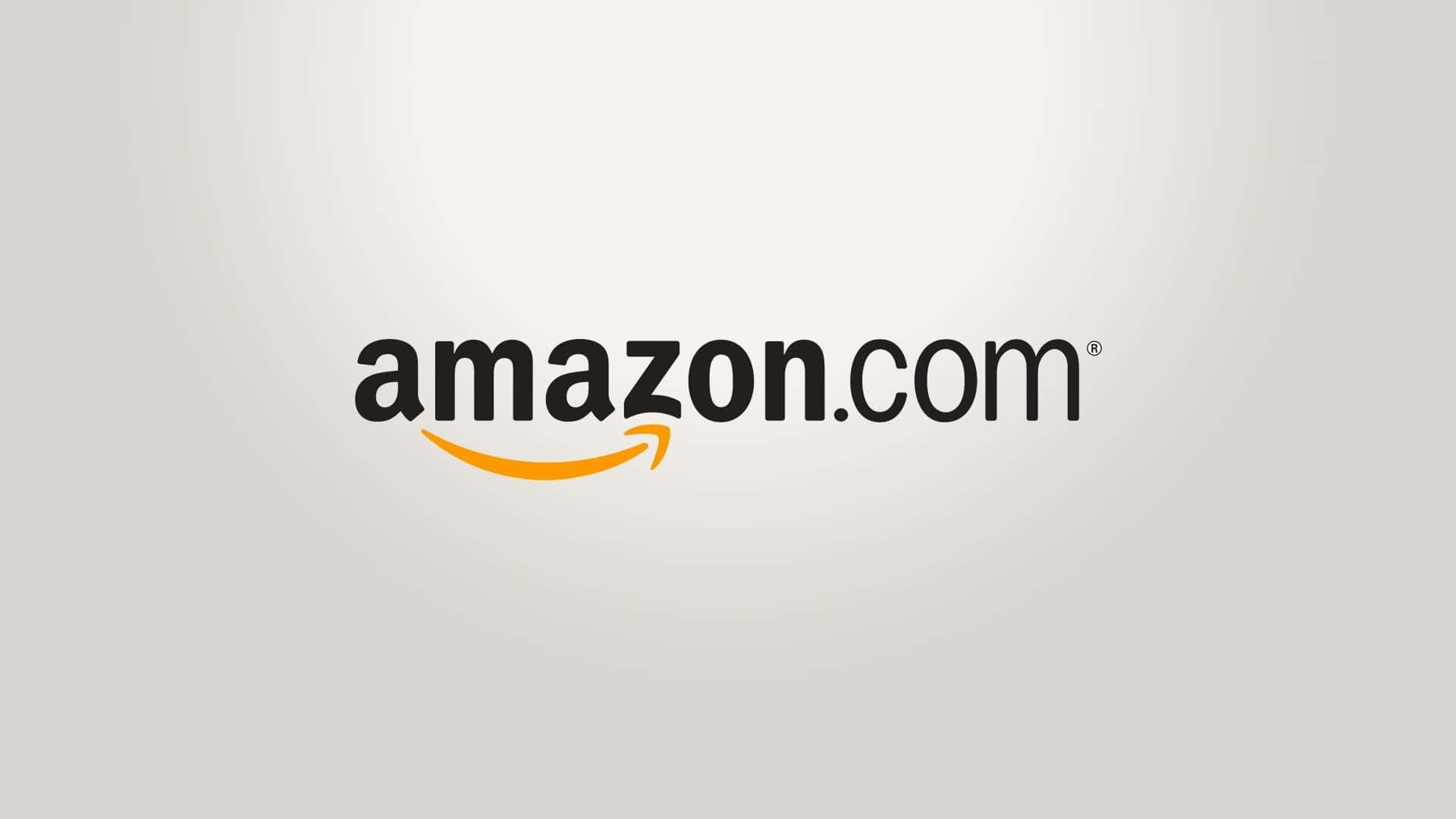 Amazon.com 標誌，帶有橙色箭頭，淺灰色背景。