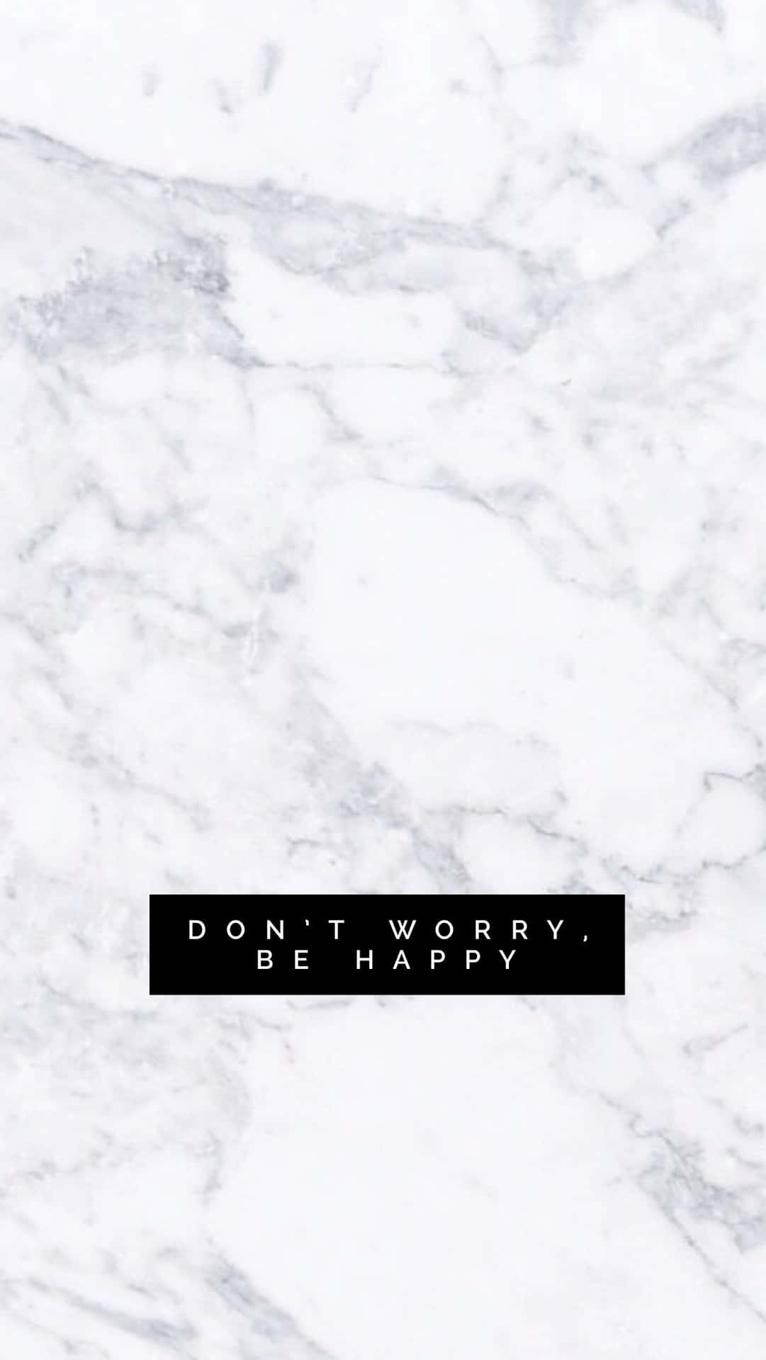 白色大理石紋理，帶有黑色文字框，上面寫著 don't worry be happy