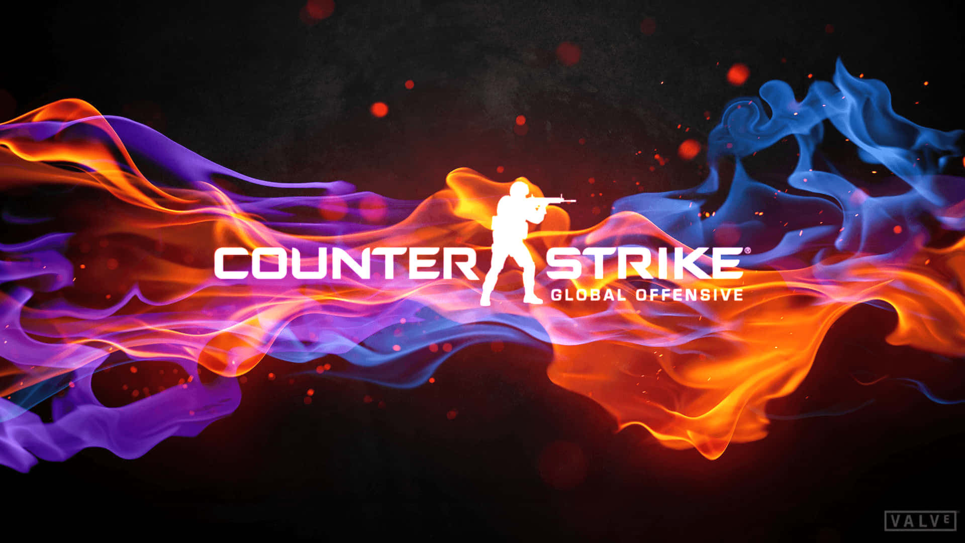 Counter Strike Global Offensive 標誌，士兵剪影置身於熾熱的橙色、藍色和紫色火焰中。