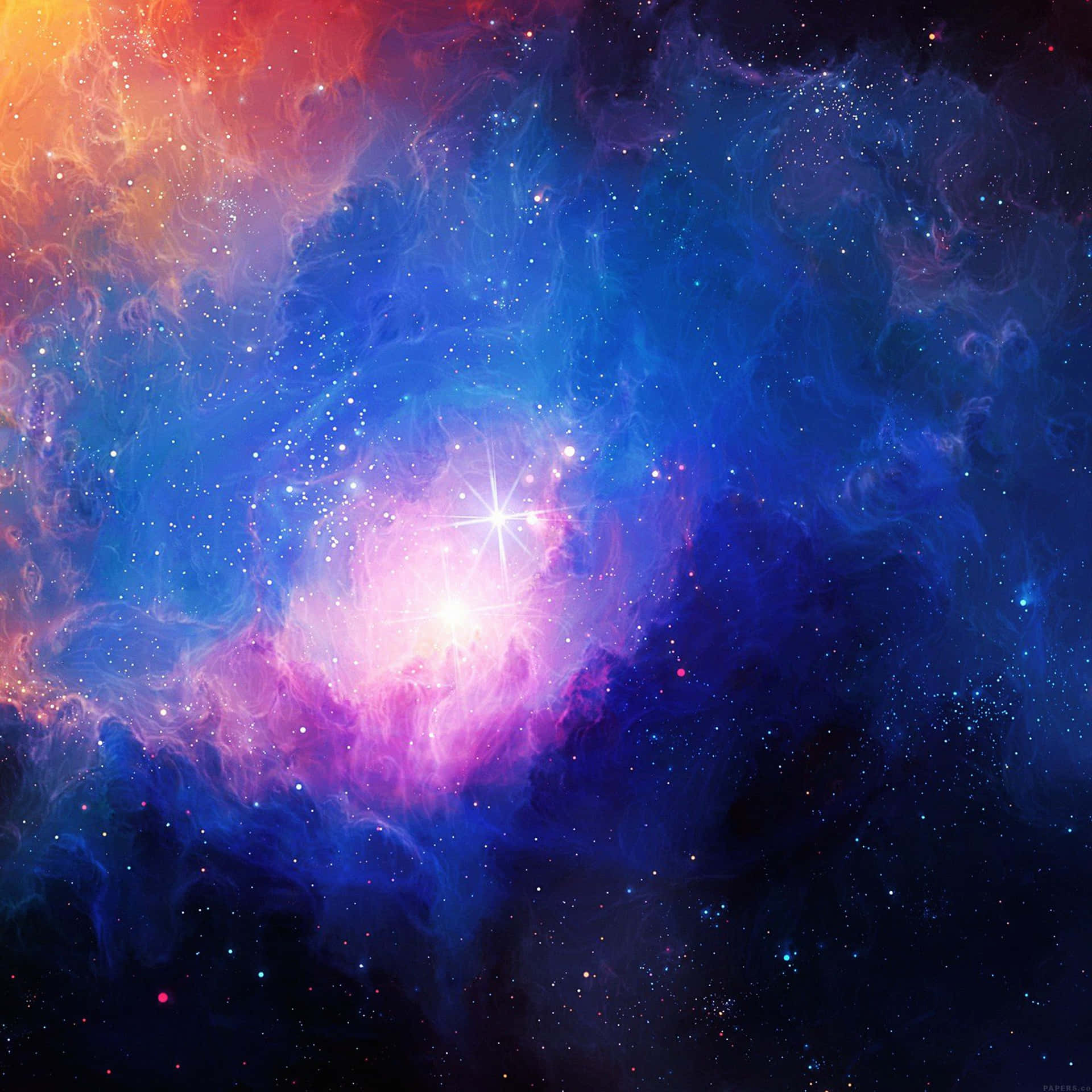 深空中帶有發光恆星和旋轉藍橙色雲團的充滿活力的宇宙星雲。