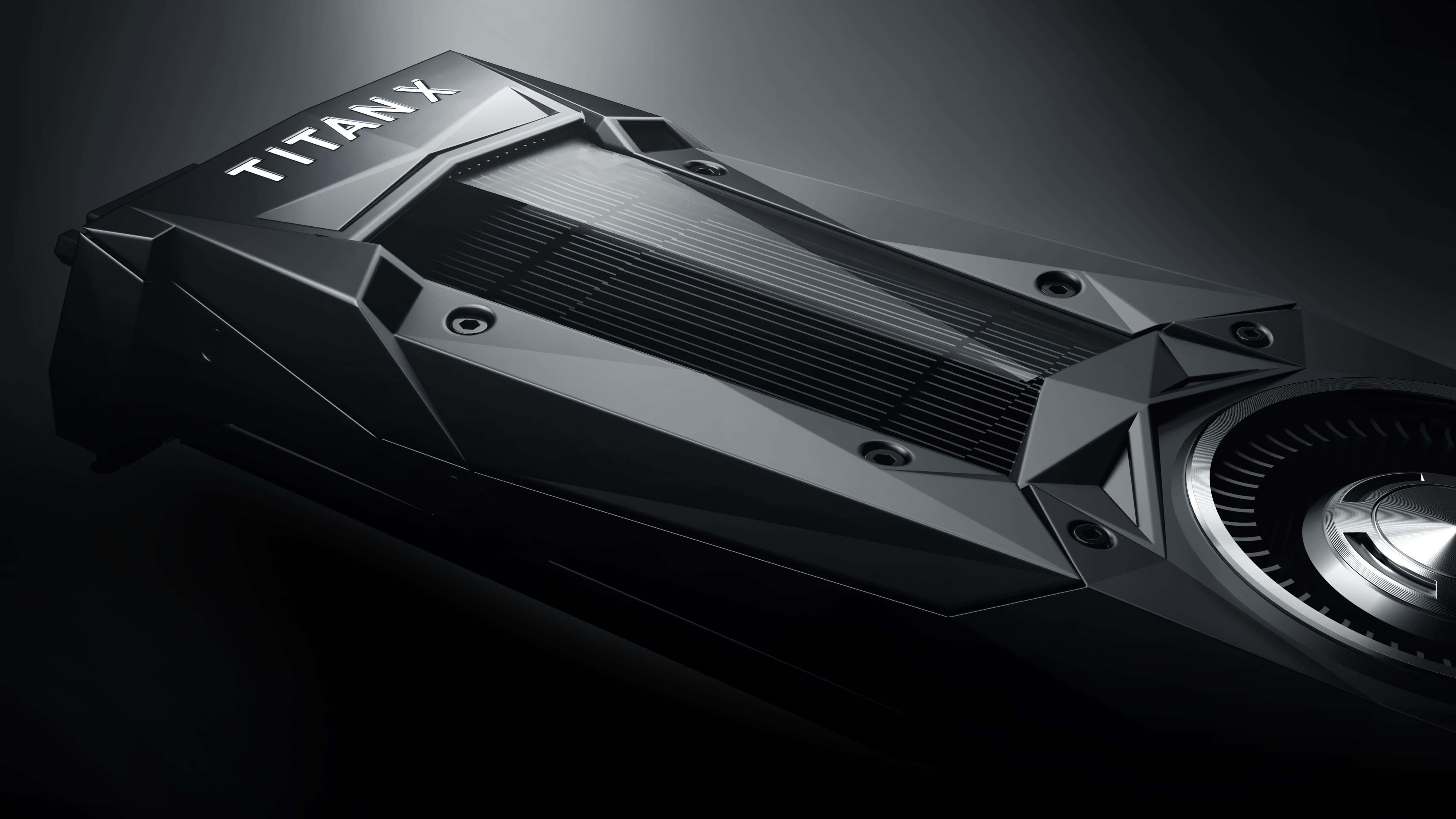 4K Graphics Cards 桌布 壁紙 — 在戲劇性的工作室燈光下，一款時尚的黑色 Titan X 顯示卡，具有棱角設計和金屬裝飾。
