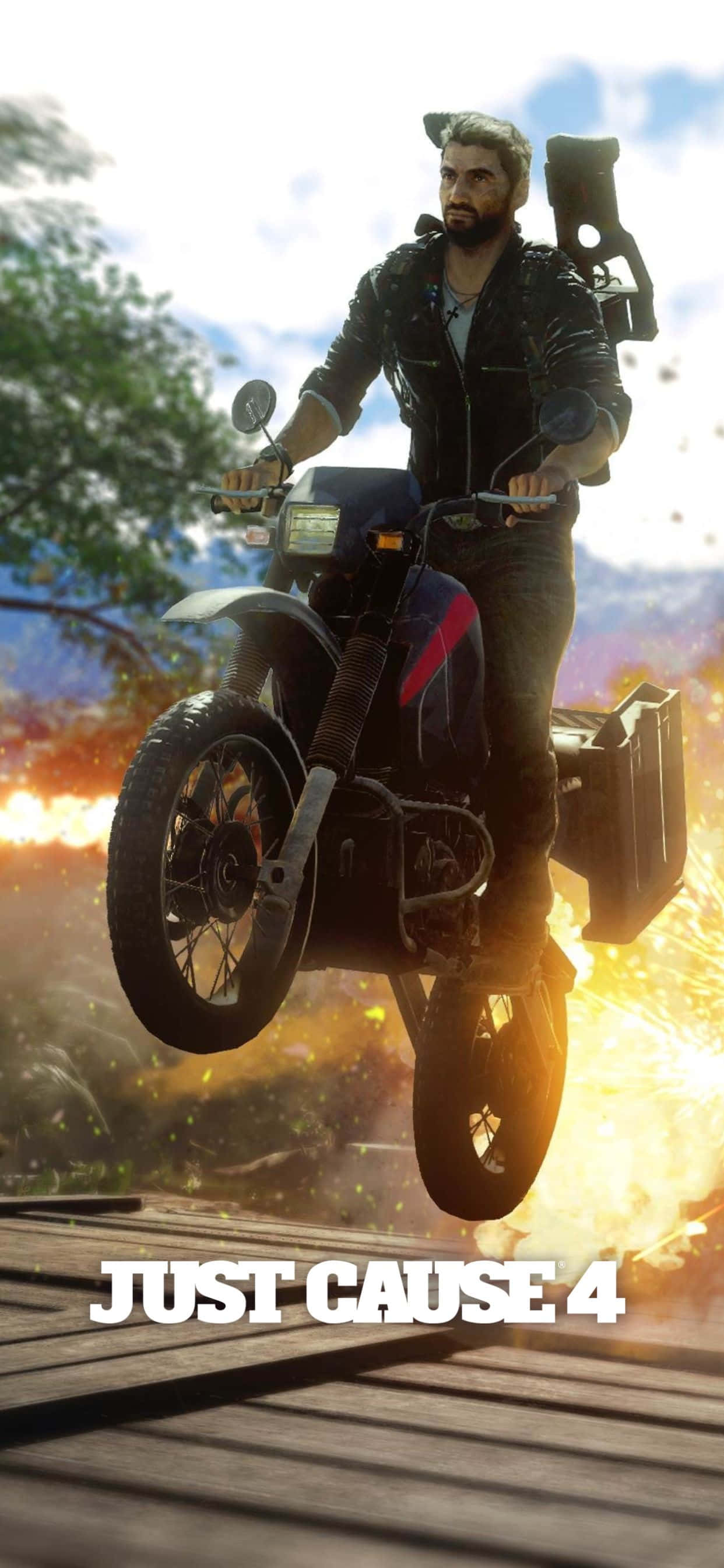 在新款 iPhone Xs Max 上暢玩 Just Cause 4 壁紙 — 一個留鬍鬚的男人穿著皮褸，在木橋上空騎電單車，身後火焰爆炸，天空明亮。