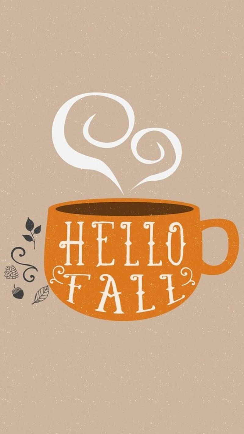 橙色咖啡杯，上面有 'Hello Fall' 文字和秋葉，背景是米色。