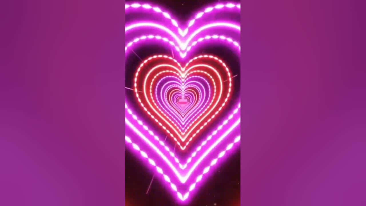 Beautiful Neon 桌布 壁紙 — 在深紫色背景上，由粉紅色和紅色霓虹燈組成的嵌套心形發光隧道。