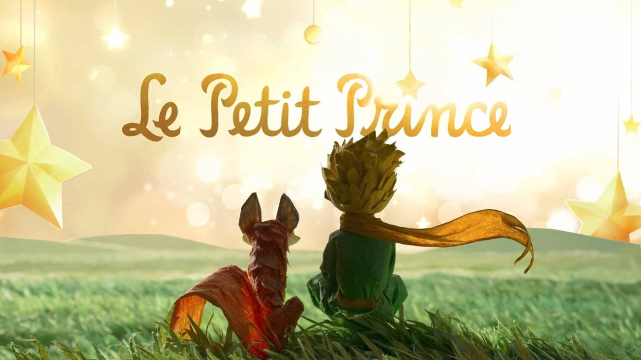 一個男孩和狐狸坐在草地上，發光的星星下寫有Le Petit Prince文字。