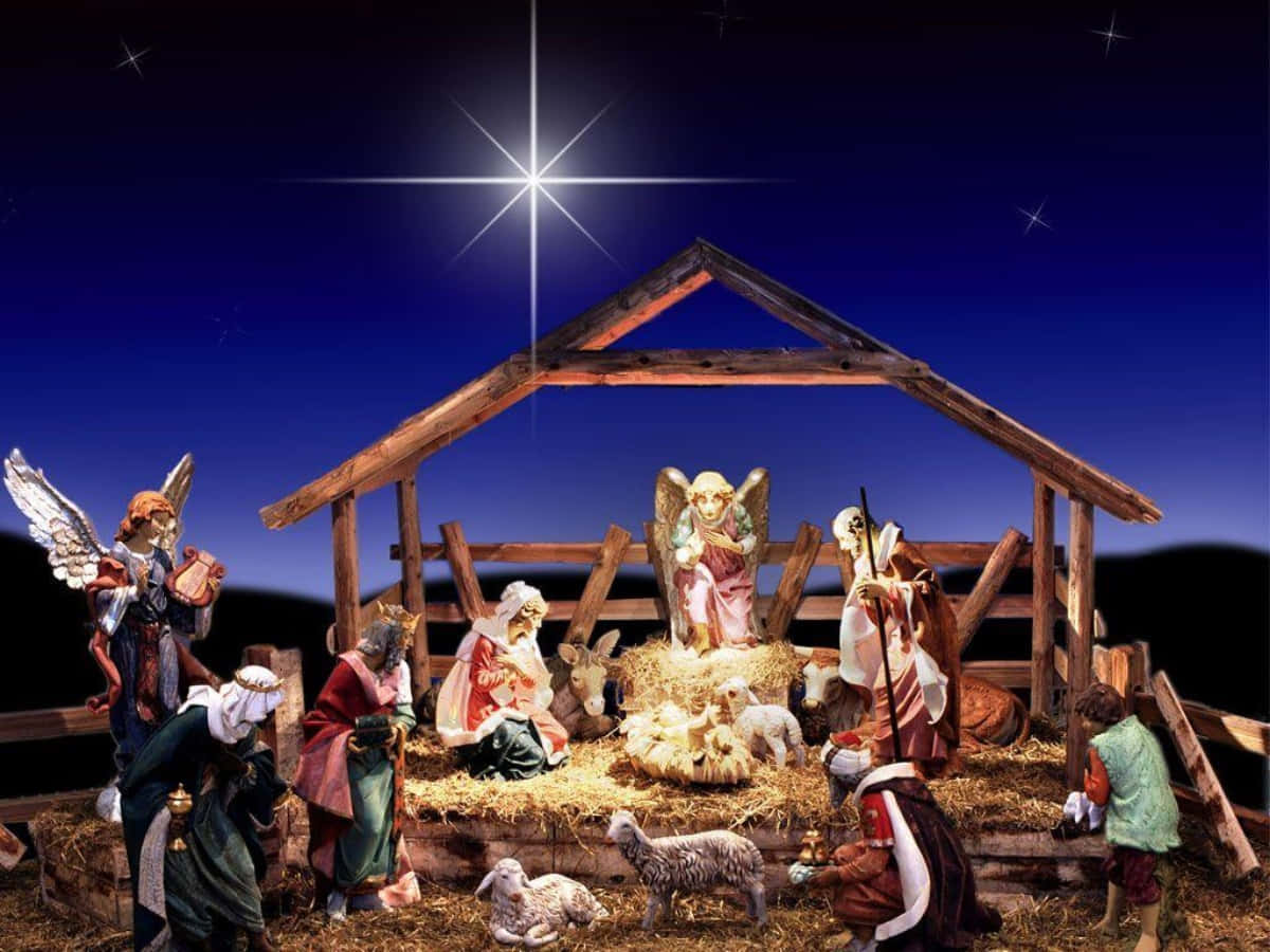 Nativity 桌布 壁紙 — 在繁星點點的夜空下，一個發光的耶穌誕生場景，人物聚集在馬槽周圍。