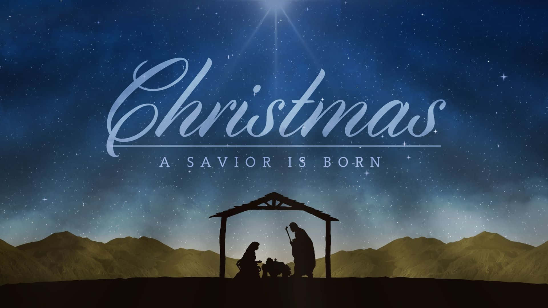 Nativity Scene 桌布 壁紙 — 在繁星點點的夜空下，剪影呈現的耶穌誕生場景，發光文字宣告聖誕節和救世主的誕生。
