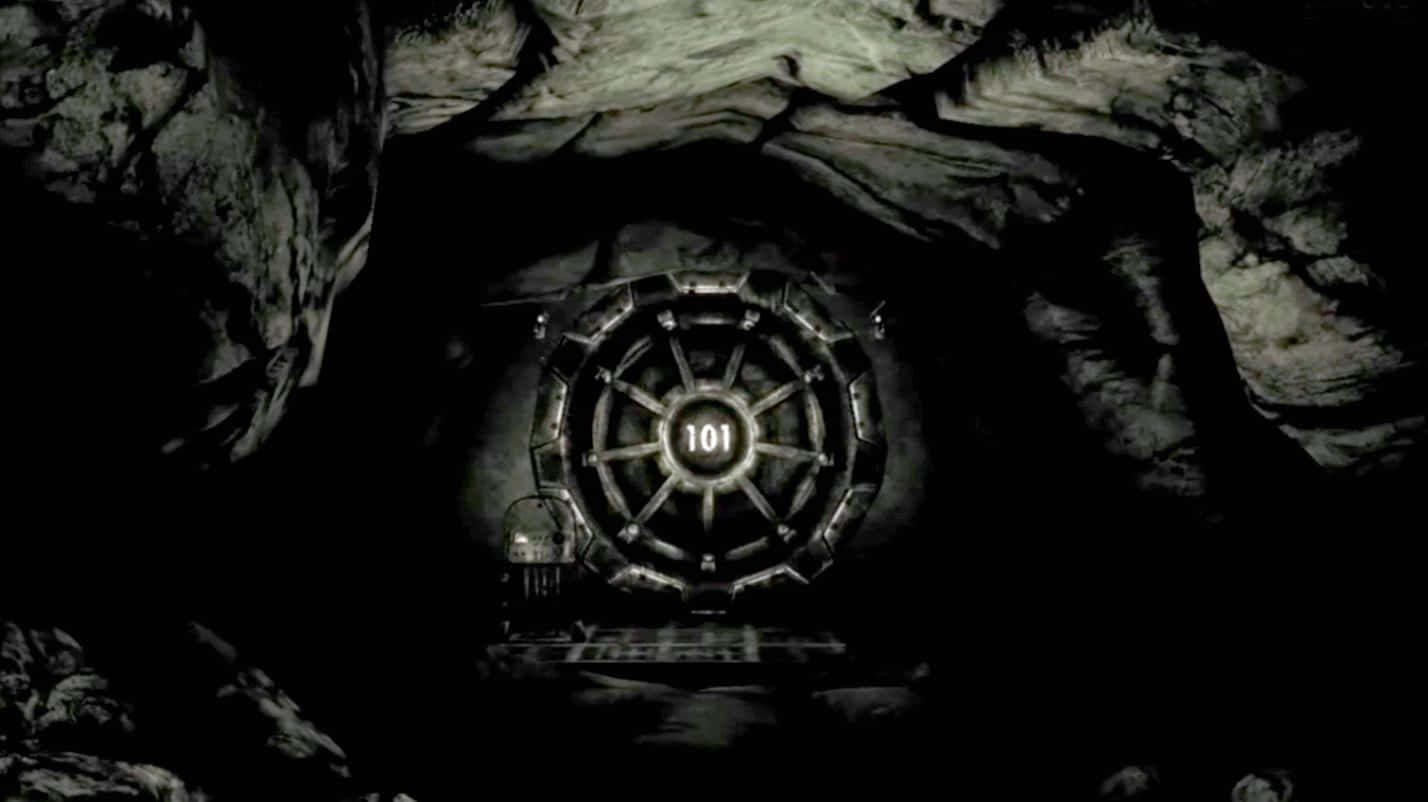 Vault 101 桌布 壁紙 — 在黑暗岩石隧道的盡頭，一扇標有101的巨大編號金庫門發出微弱的光芒。