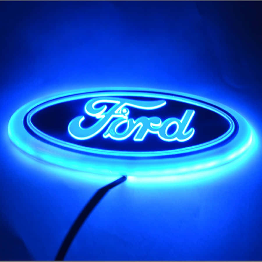 Ford Logo 桌布 壁紙 — 在黑暗背景上發出明亮光芒的藍色福特標誌霓虹燈招牌。