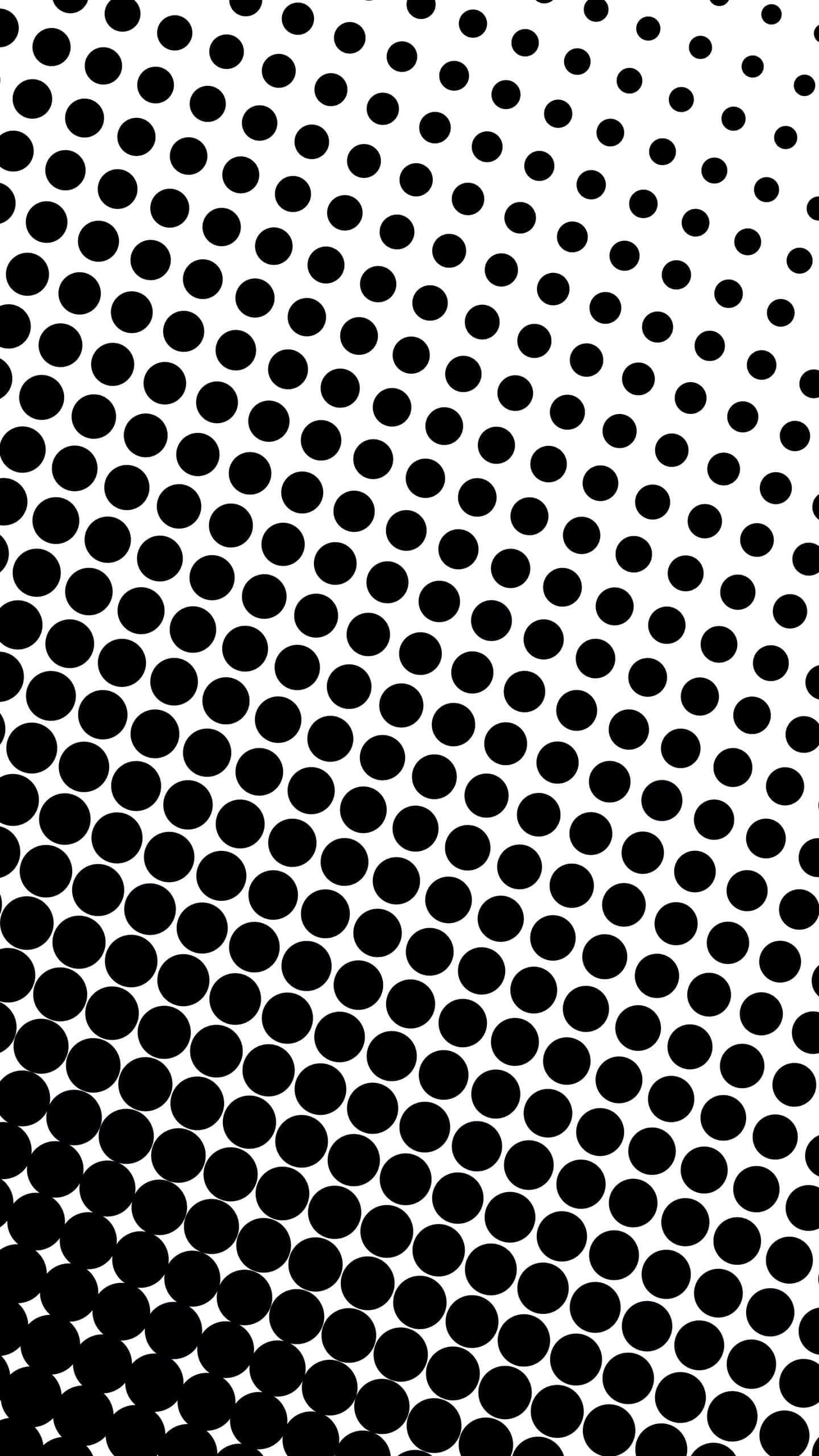 Black And White Dots 桌布 壁紙 — 均勻分佈的圓點形成大膽的黑白圖案，在整個畫面中營造出動態的對角線視覺流動。
