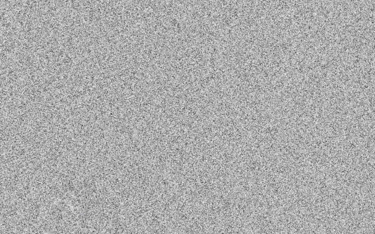 靜態gif 桌布 壁紙 — 均勻灰色紋理表面的特寫，帶有細微斑點圖案和微妙的色調變化。