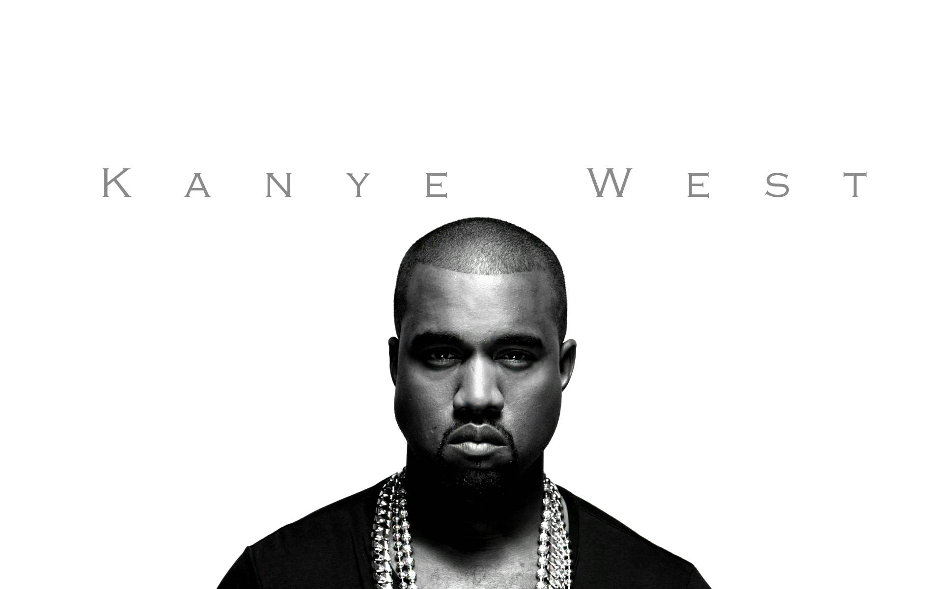 坎耶·威斯特《The Life Of Pablo》專輯封面 壁紙 — 一幅鮮明的黑白肖像，Kanye West 在純白背景前強烈凝視，上方以間距文字顯示他的名字。
