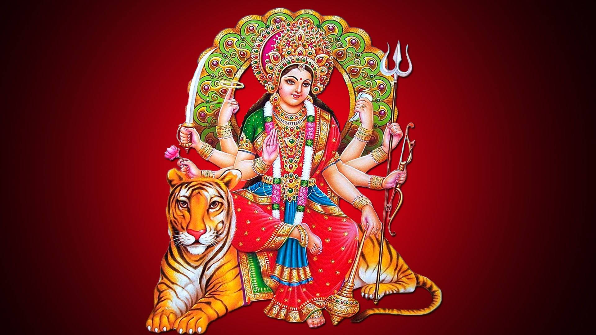 坐姿 Durga Mata 高清 壁紙 — 一幅色彩鮮豔的插圖，描繪印度教女神杜爾迦（Durga）有十臂騎虎，背景為深紅色。