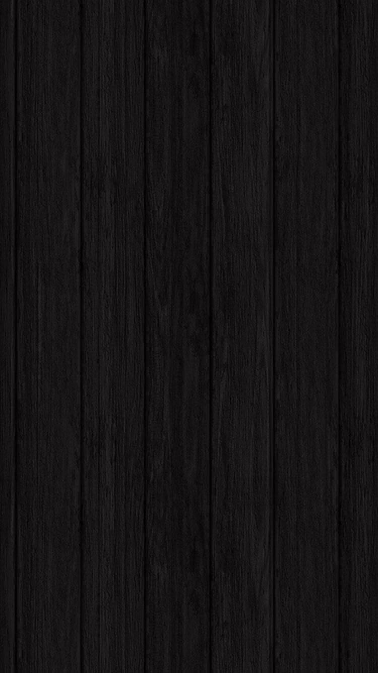 iPhone 桌布 壁紙 — 垂直黑色木板帶有細微的木紋紋理，營造出簡約而富有情調的背景。
