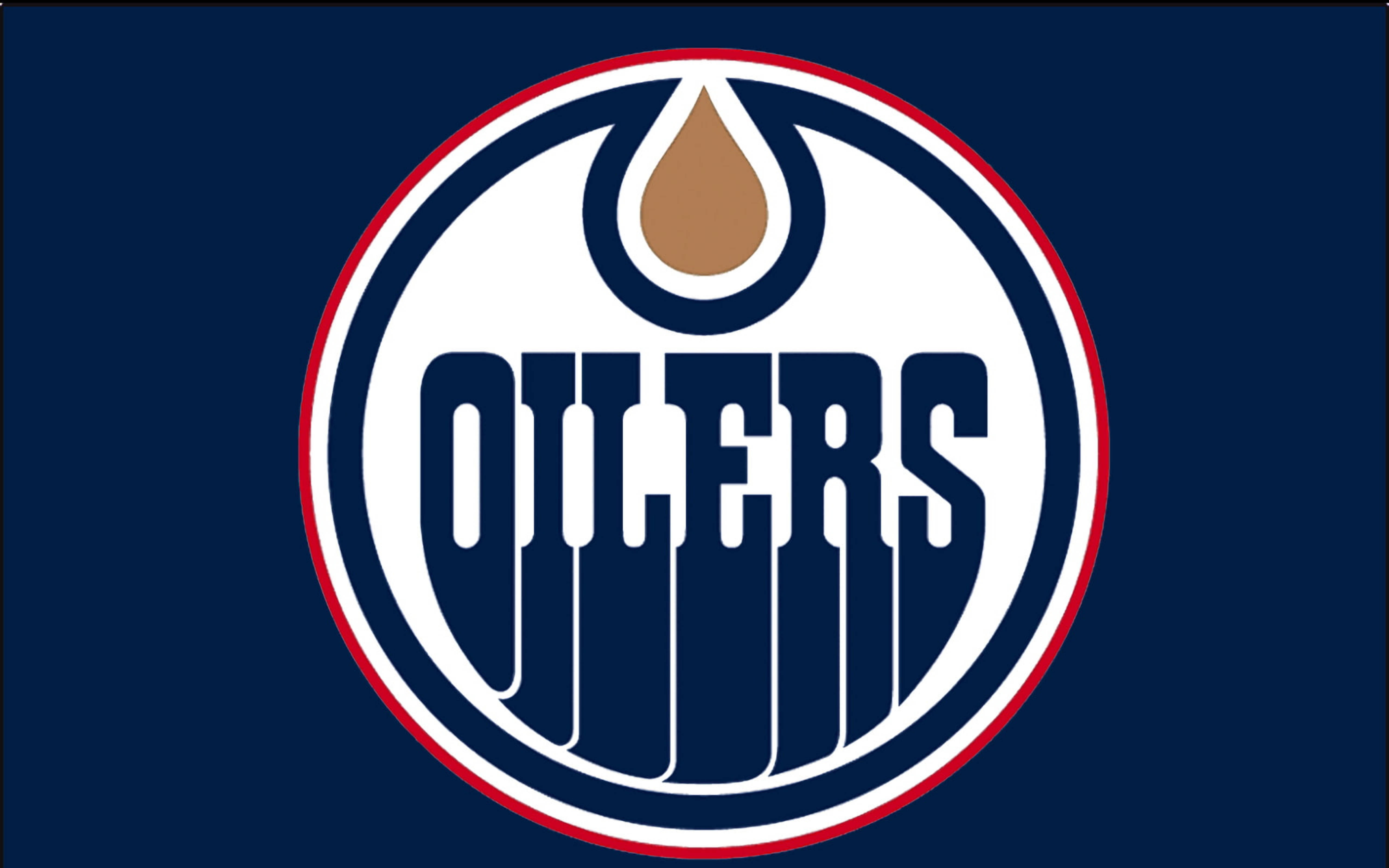 埃德蒙頓油人隊隊徽NHL 壁紙 — 愛民頓油人隊標誌以海軍藍背景上的圓形徽章內，在粗體字上方有一個風格化的油滴。