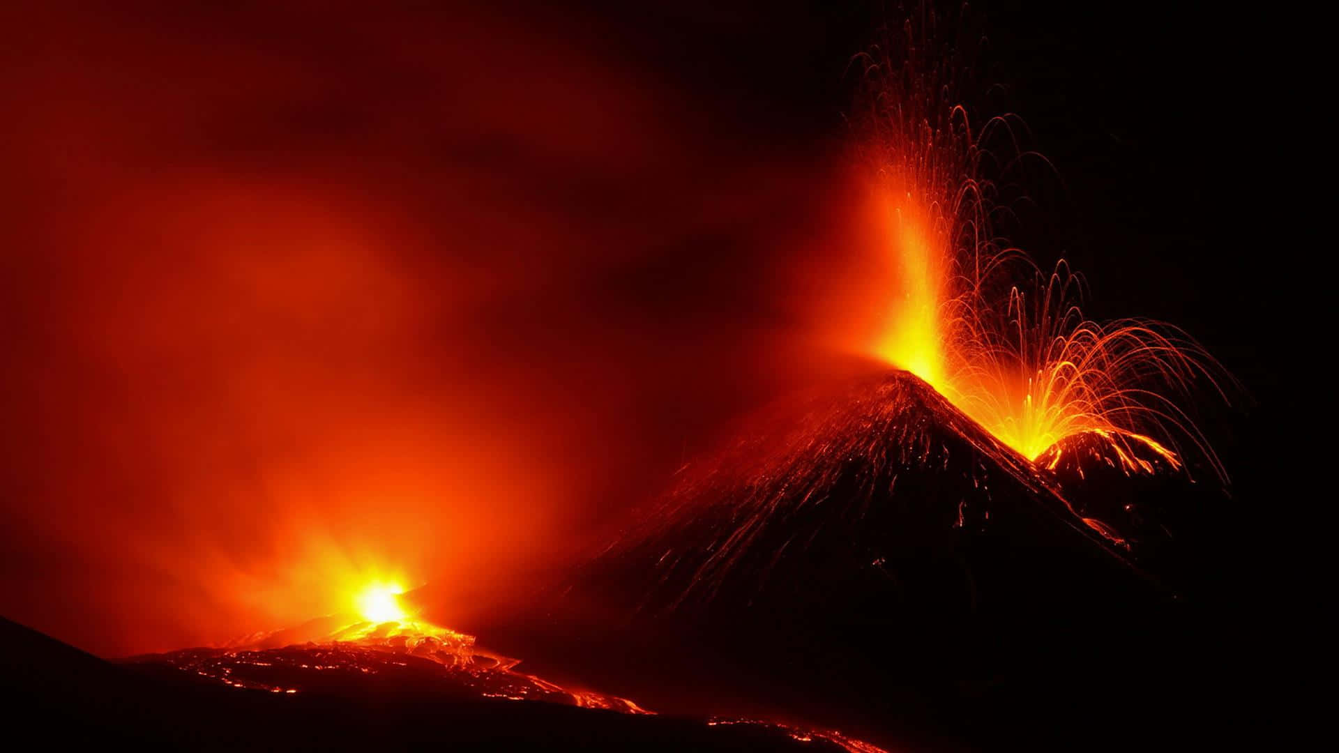 夜間火山爆發，明亮的熔岩流和熾熱的爆發。 — 熱門 GIF 壁紙