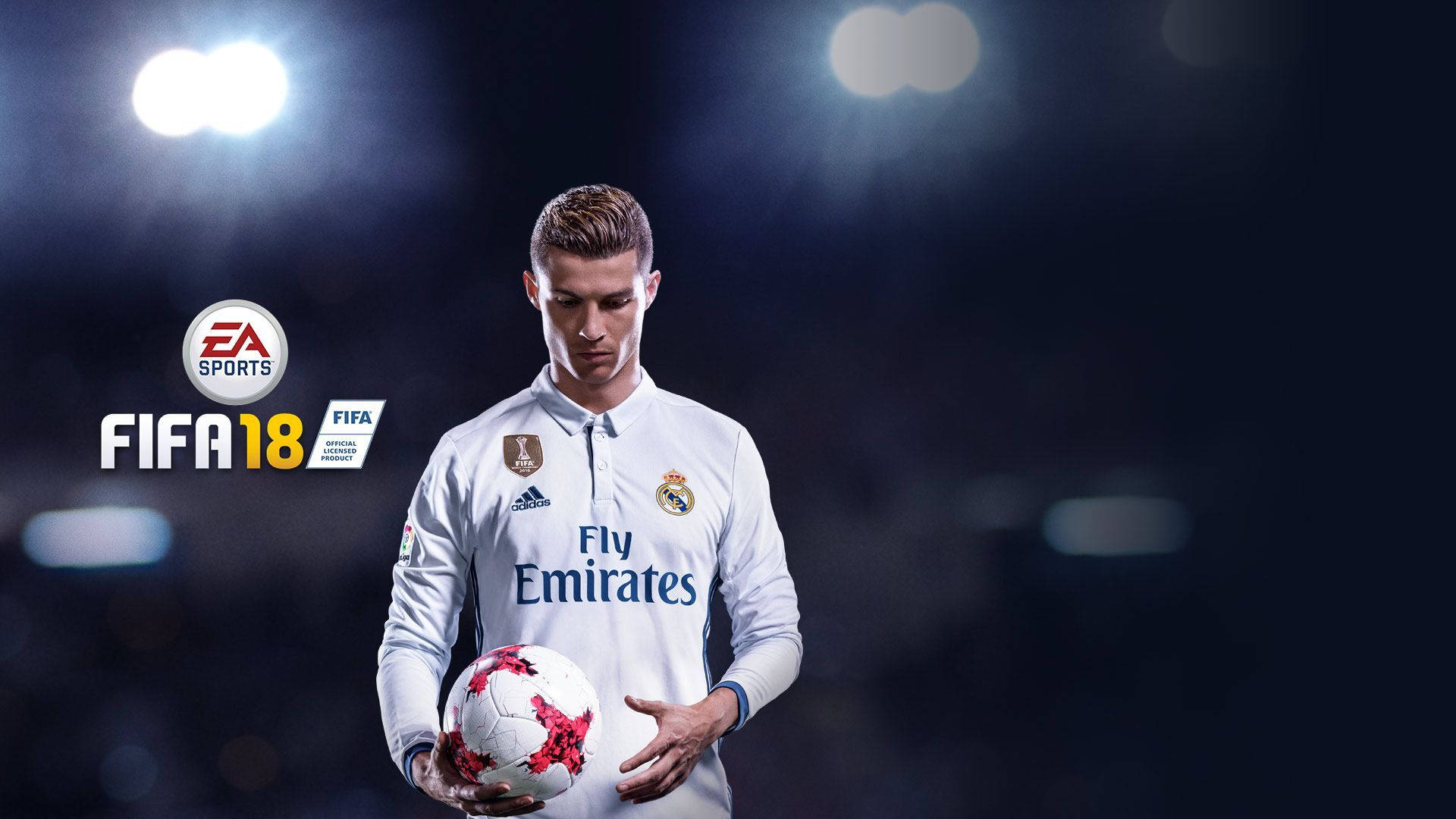 皇家馬德里 桌布 壁紙 — 基斯坦奴·朗拿度身穿皇家馬德里球衣，在FIFA 18電子遊戲宣傳中於球場燈光下手持足球。