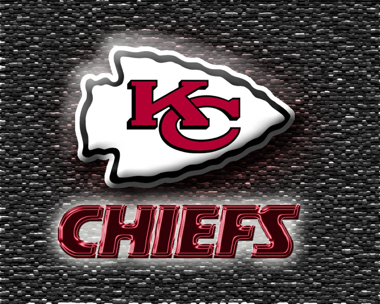 Kansas City Chiefs 標誌，帶有發光紅色文字，背景為紋理灰色。