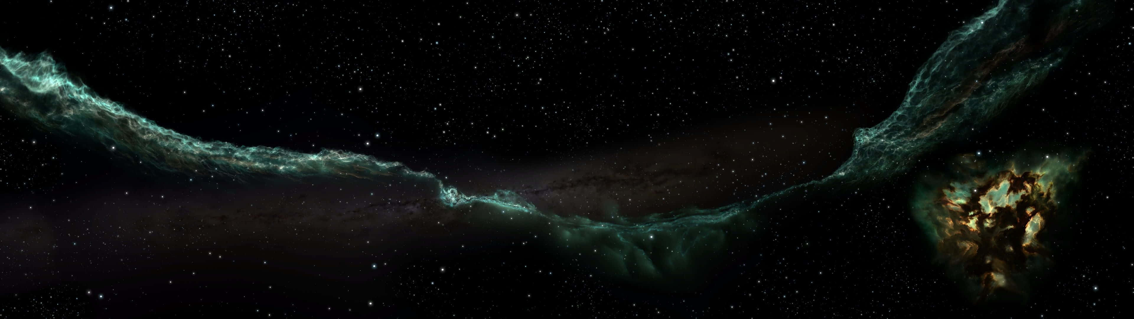 壯觀的星雲景象 壁紙 — 一個宇宙星雲，發光的青綠色和金色氣體在深空星場中蜿蜒。
