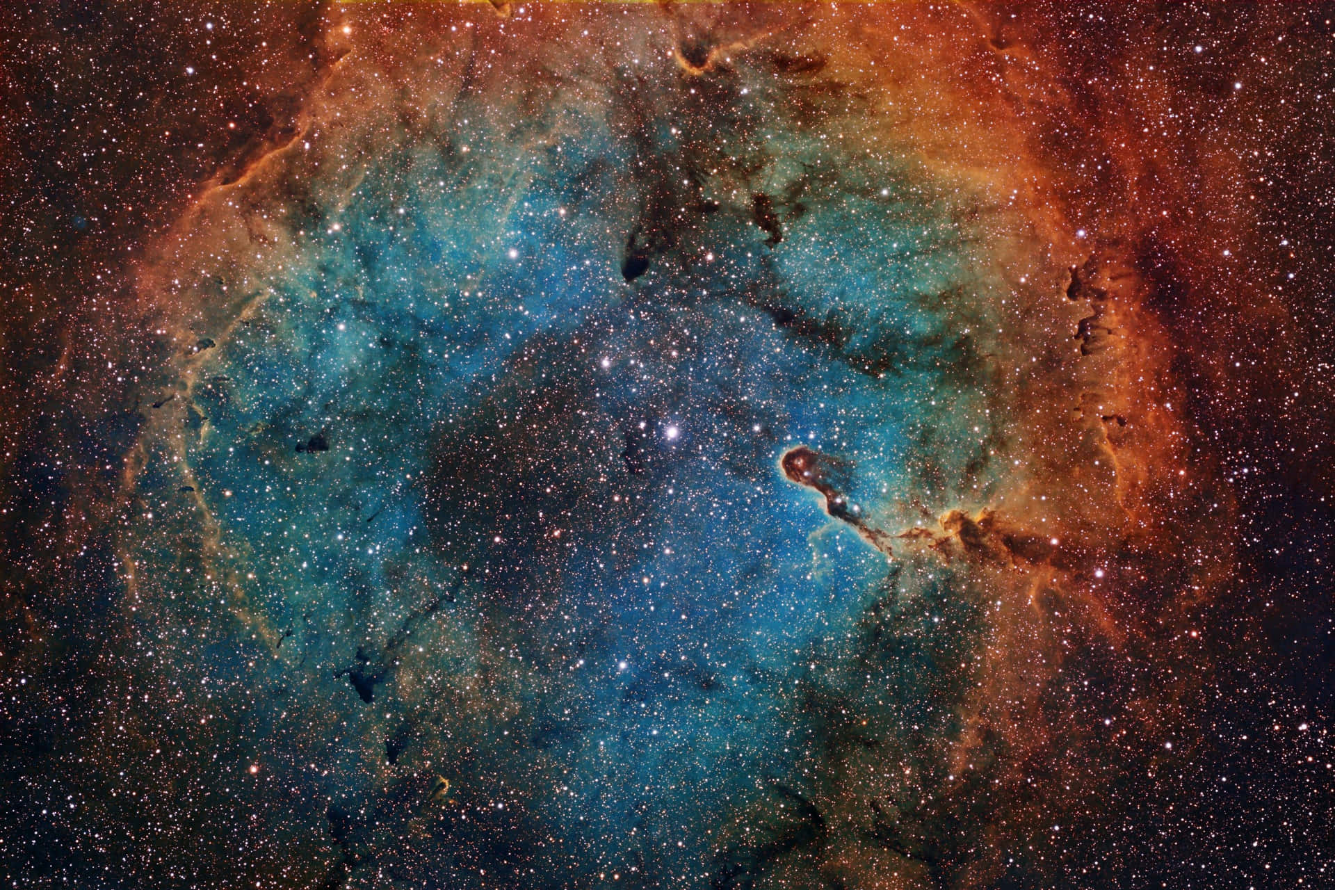 鮮豔的藍色和橙色星雲，在深空中閃爍著無數星辰。