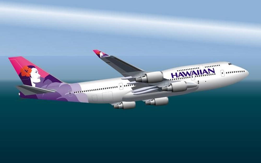 夏威夷航空飛機在日間飛越海洋