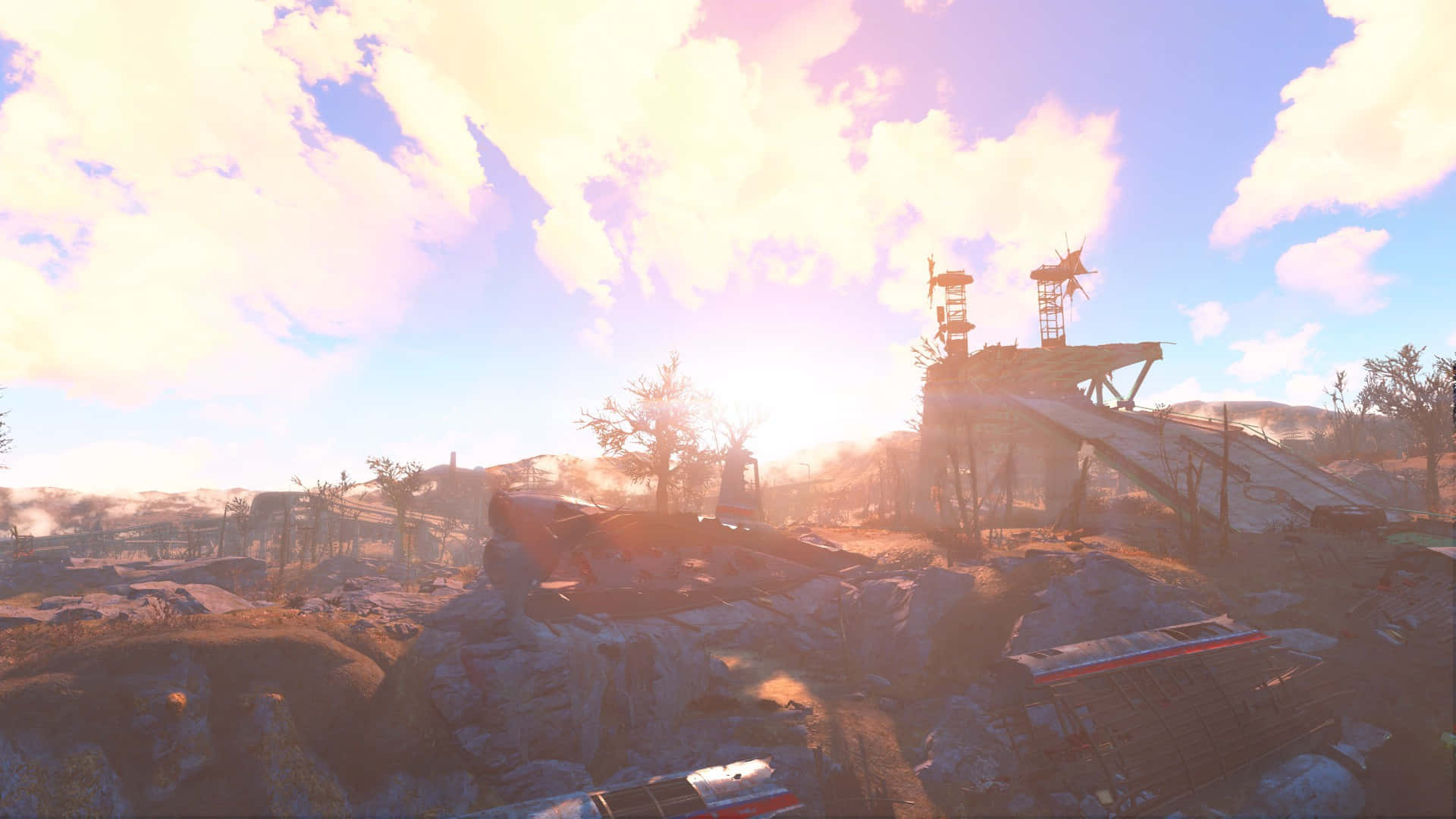 Fallout 4 Wasteland 桌布 壁紙 — 夕陽以溫暖的光線沐浴著廢棄的工業景觀，顯露出破損的機器和骨架般的樹木。