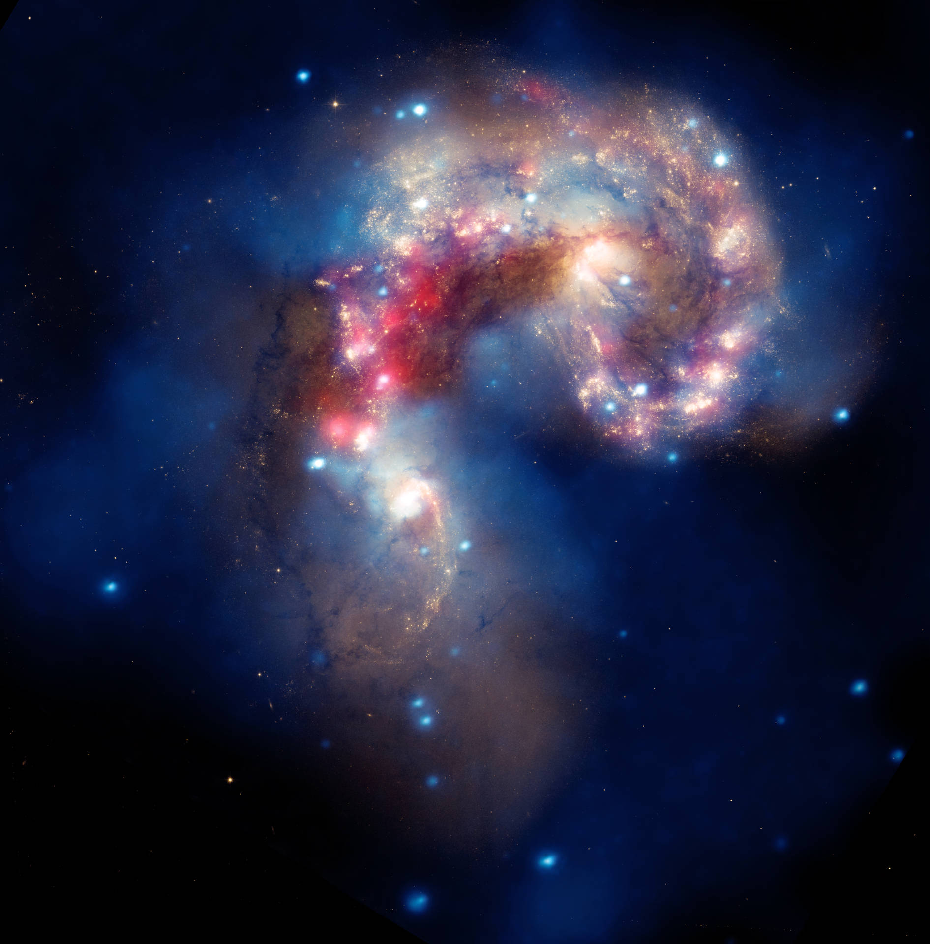一個色彩繽紛的螺旋星系，在深空中閃爍的星雲和散落的星星。