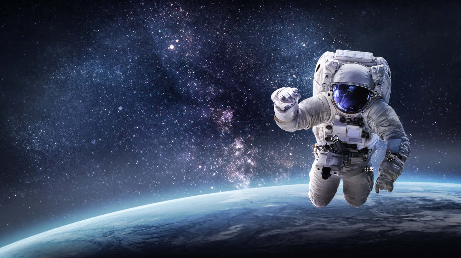 太空人在地球上空太空漂流，背景有星星和星系。