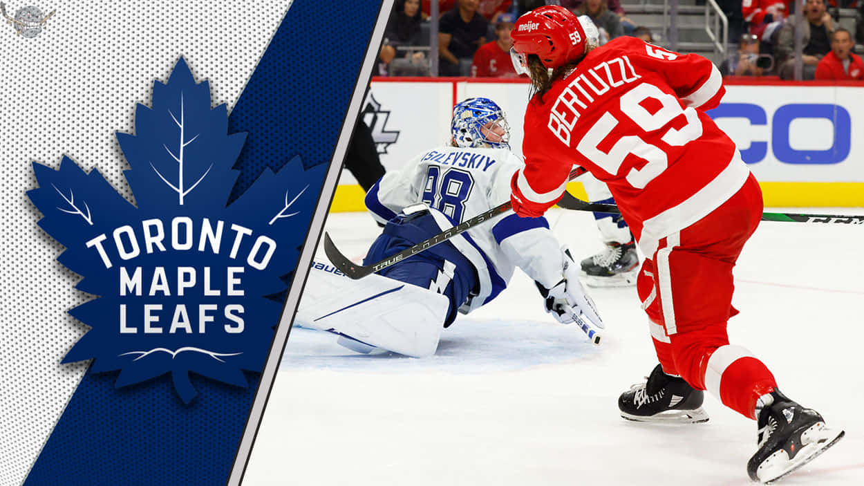 Tyler Bertuzzi 桌布 壁紙 — 多倫多楓葉隊球員身穿紅色球衣，在激烈的冰球比賽中與藍色守門員對峙。