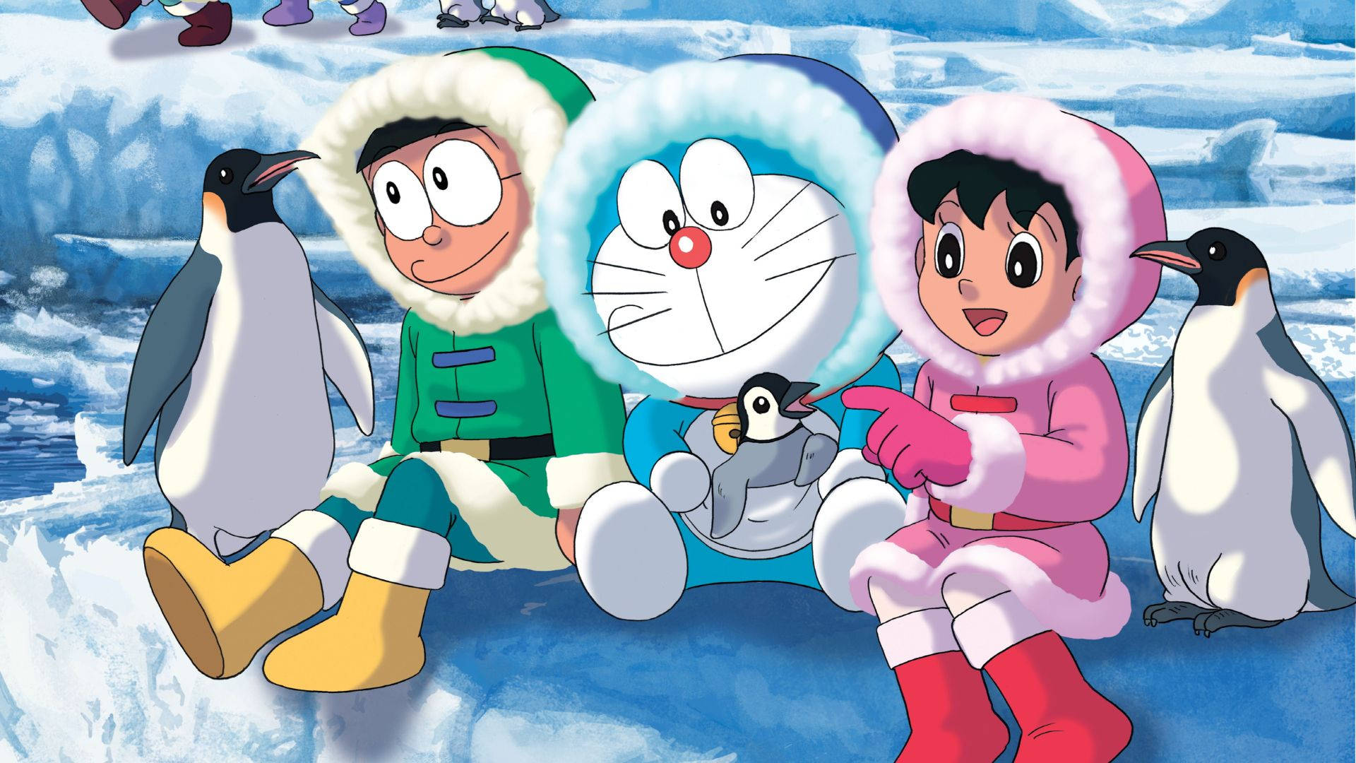 Doraemon 桌布 壁紙 — 多啦A夢和朋友們穿著冬季裝備與企鵝坐在冰天雪地下，天空湛藍。