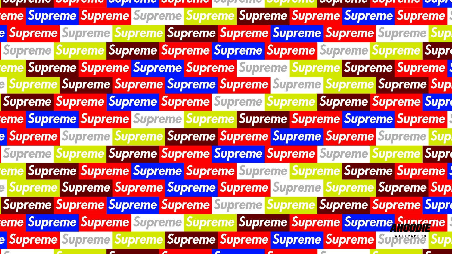 多彩Supreme 壁紙 — 一個充滿活力的重複圖案，由大膽的紅色、藍色、綠色和白色區塊中的「Supreme」標誌組成。
