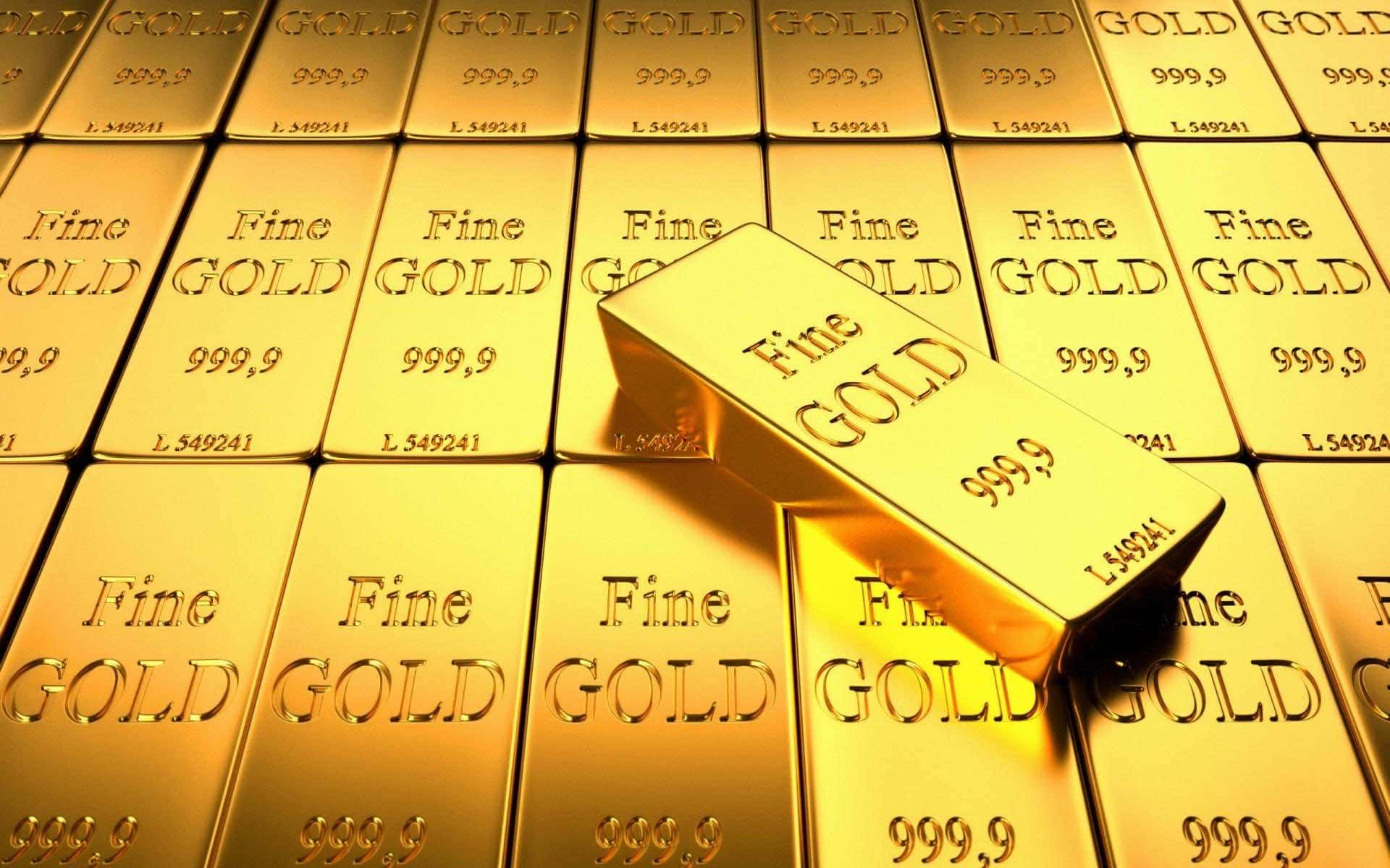 一堆金條，其中一條放在頂部