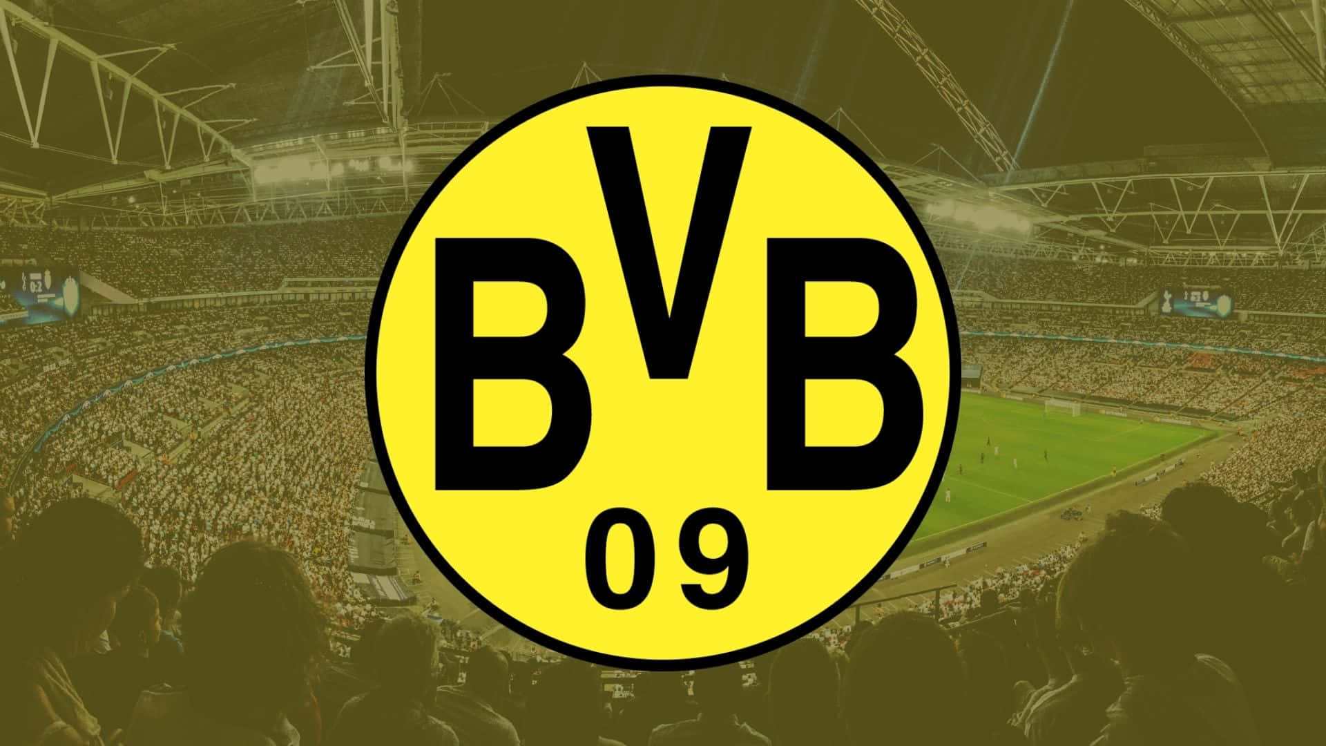 BVB 09 足球會標誌在夜間覆蓋著一個擠滿人的球場。