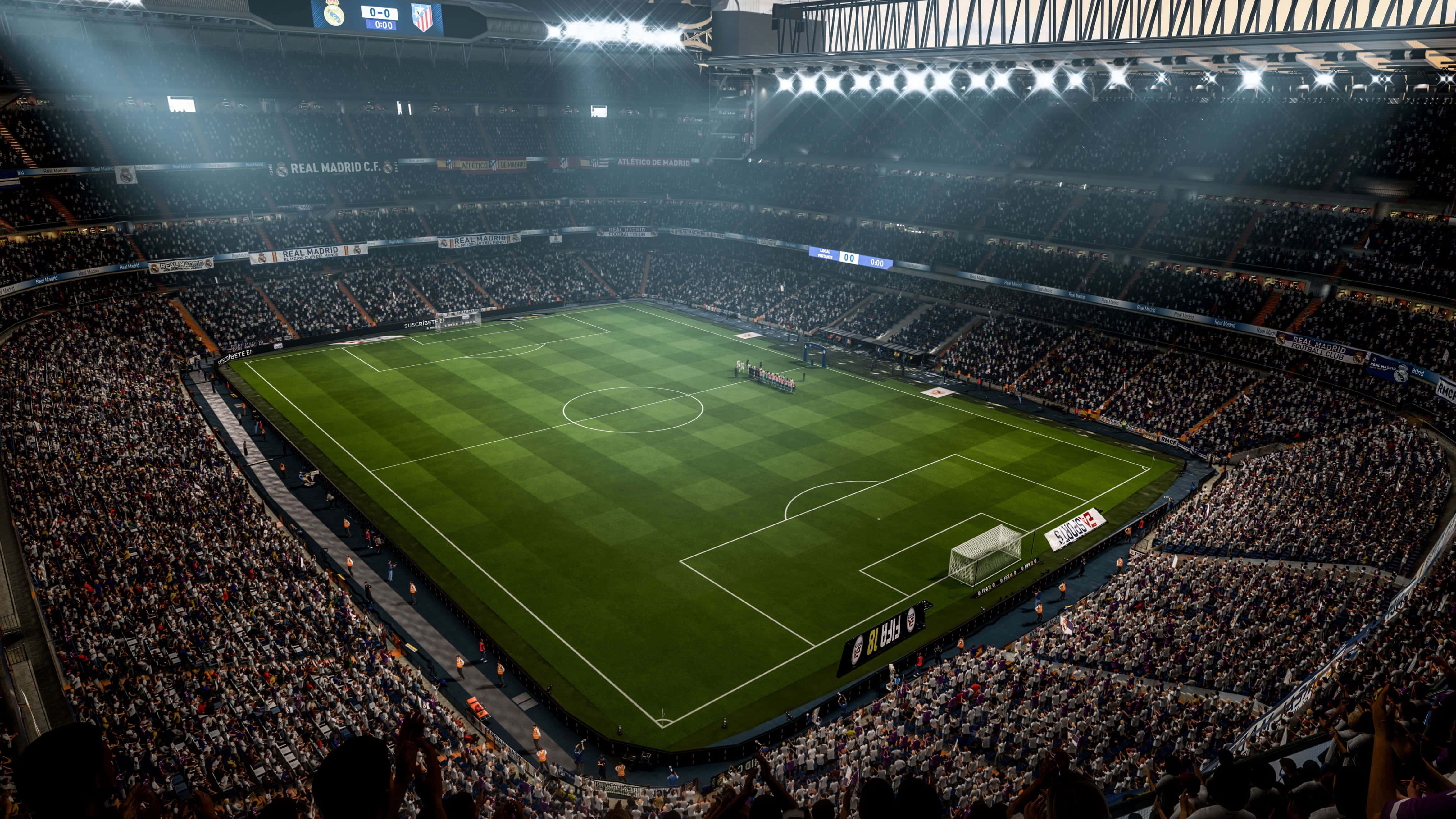 Soccer Stadium 桌布 壁紙 — 夜晚擠滿觀眾的足球場鳥瞰圖，明亮的燈光照亮充滿活力的綠色球場和喧囂的人群。